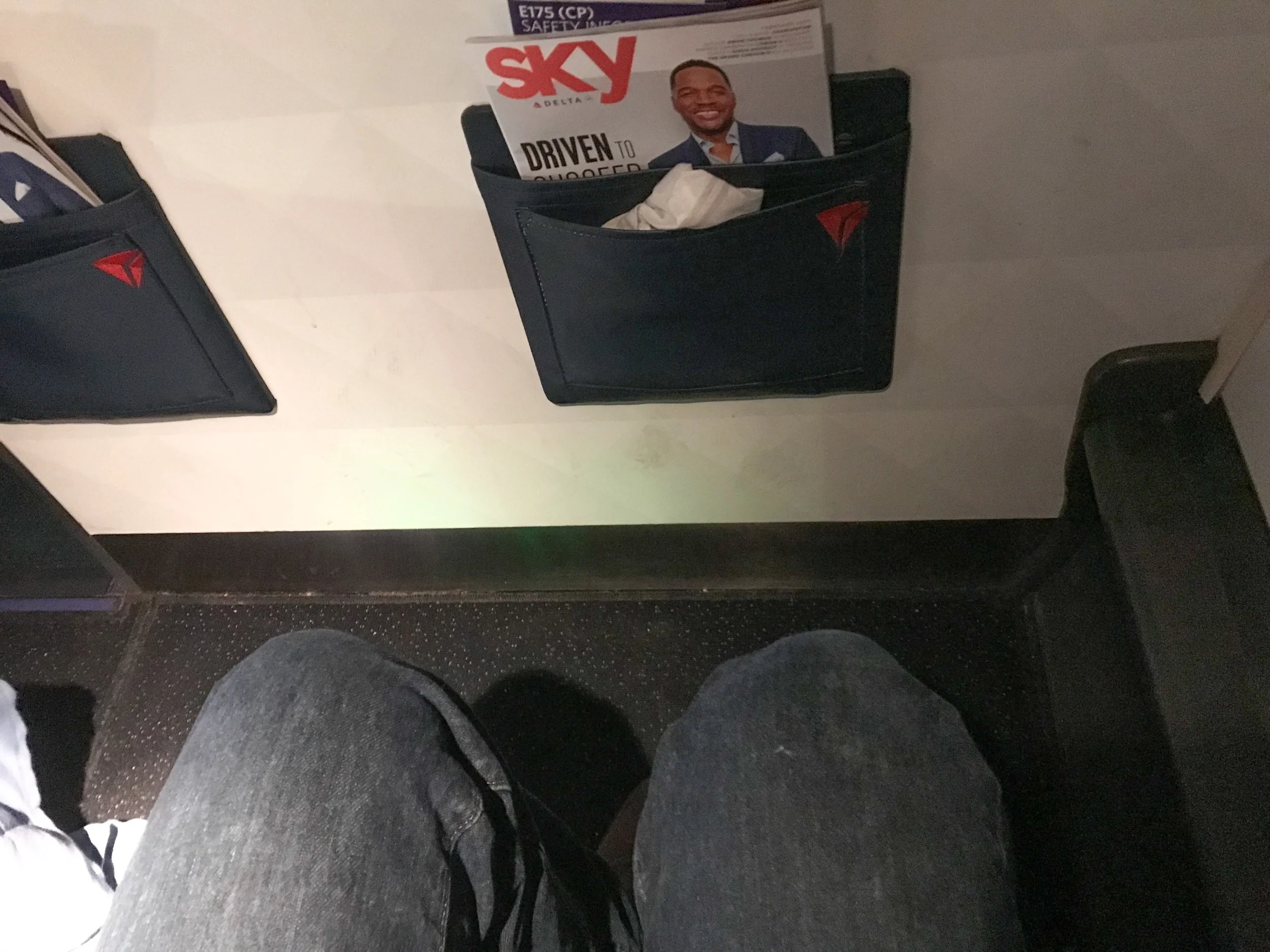 The ERJ-175 has a small shelf next to the window that doubles as a great footrest.