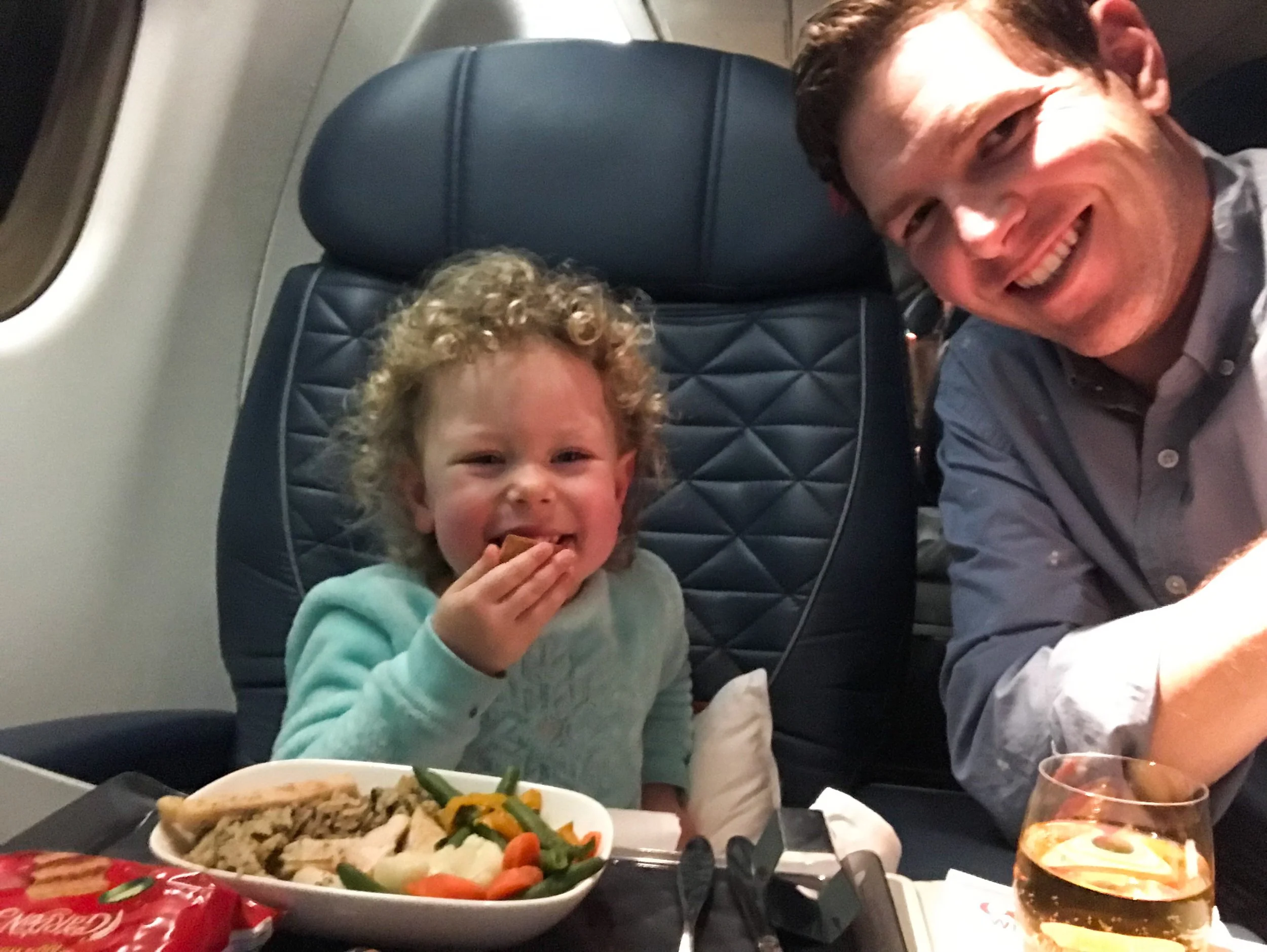 You can select a series of special meals (kosher, dairy free, vegan, etc.) up to 24 hours before departure. I forgot to order a children’s meal for my daughter ahead of time, but she was happy with the chicken and veggies. The flight attendants also offer a snack basket after dinner, with fresh fruit, granola bars, and other snack options.