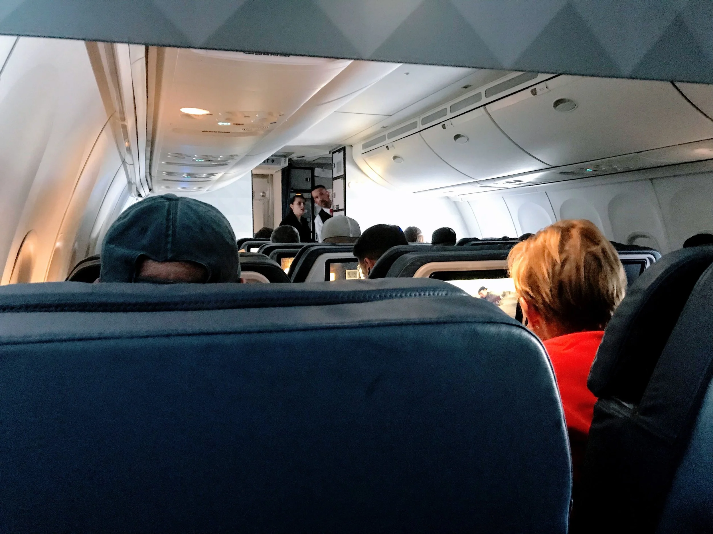 No IFE screen on the seat in front of me. Instead, it pulls out from under the seat. Which isn’t a big deal, but means it must be stowed for taxi, takeoff and landing.