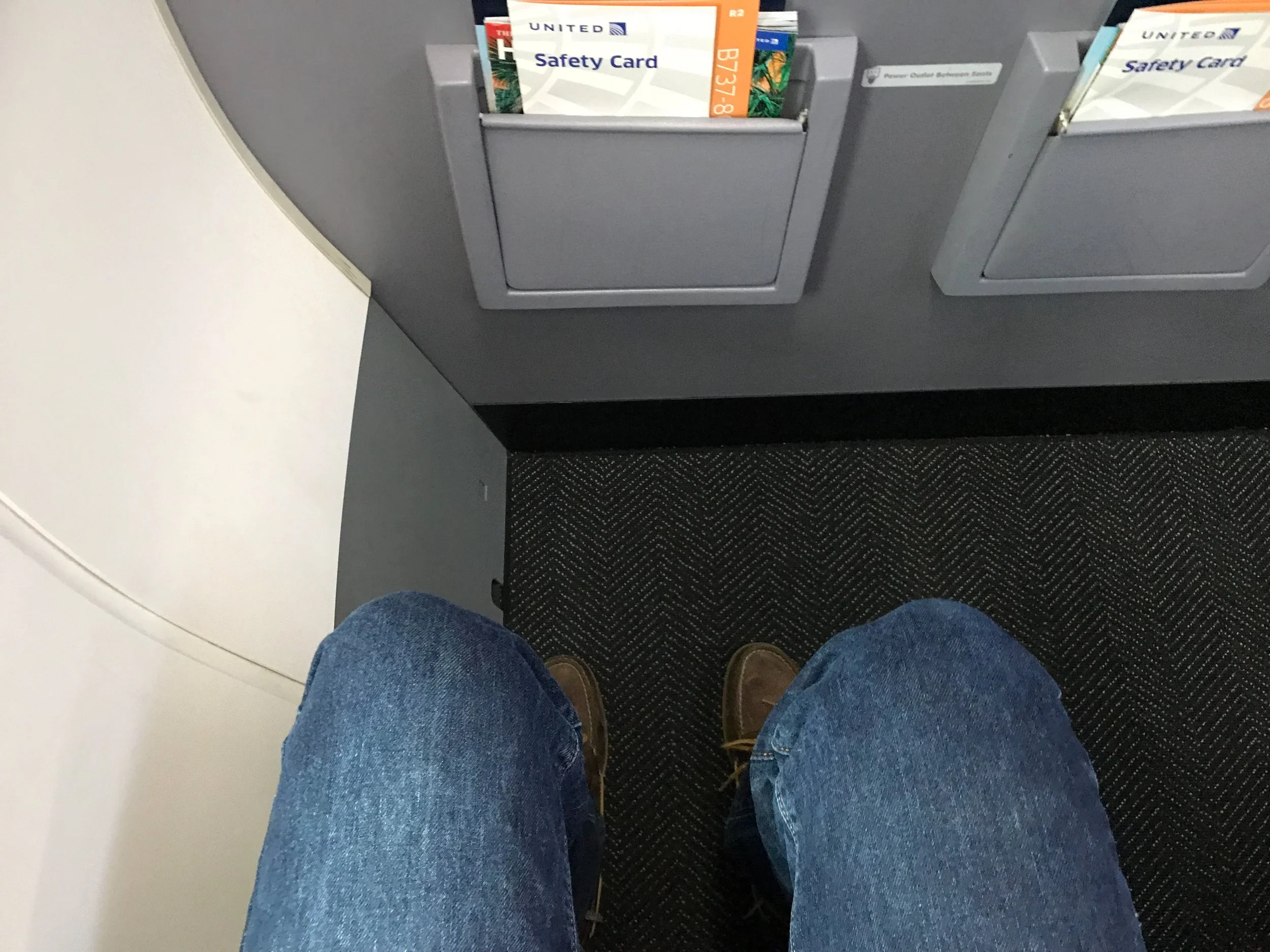 Despite the position of the bulkhead, there was ample legroom. More than any other row in Economy Plus.