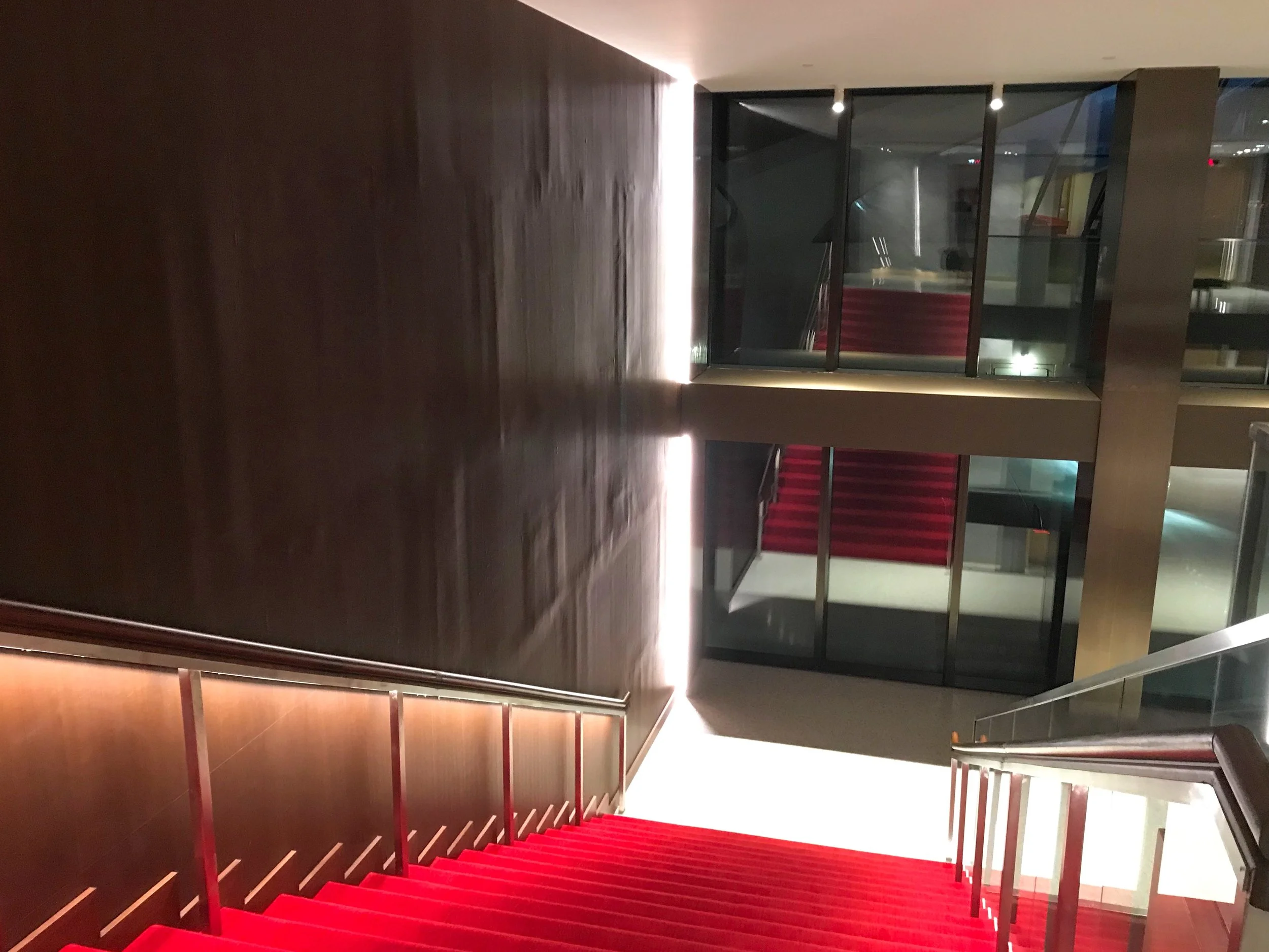 There is what appears to be water damage on the faux wood panels in the stairwell.