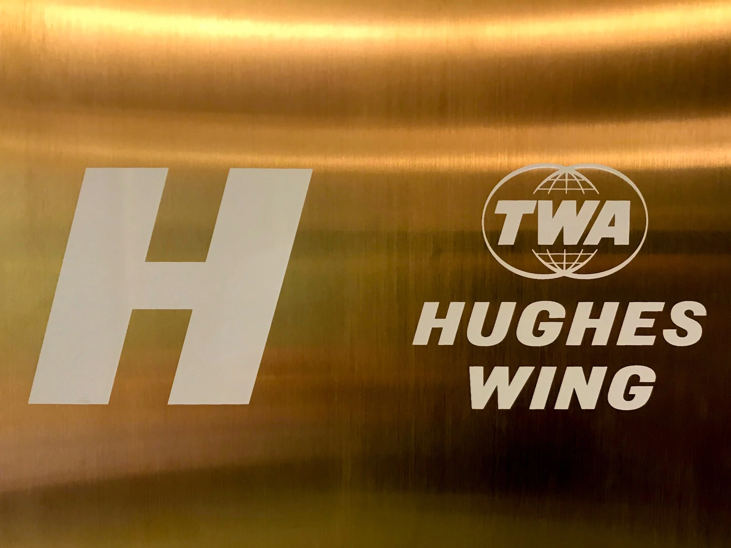 There are two wings, each on eather side of the lobby, accessible through the bridge to T5. One wing is named after the famous TWA owner Howard Hughes, and the other is named after Eero Saarinen.
