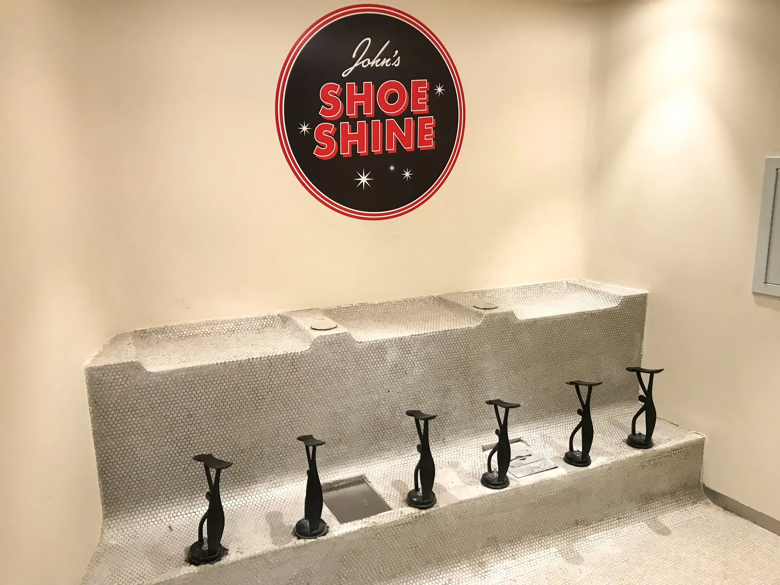 The historical charm of the building is retained, including a shoe shine station.