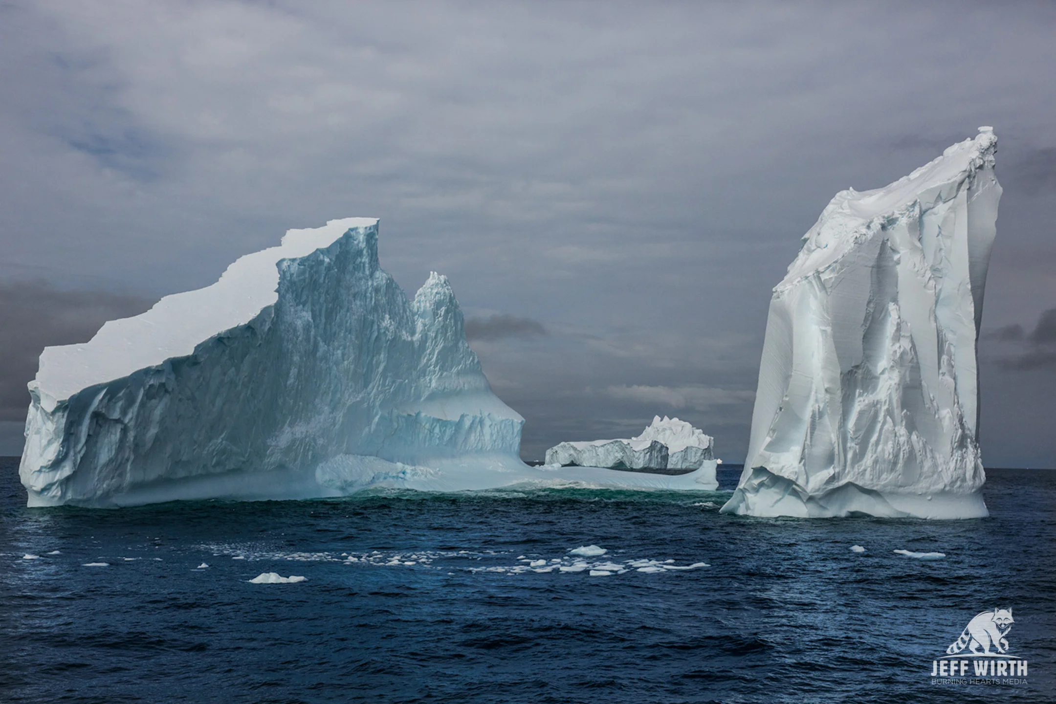 A massive iceberg floats by in the southern ocean, Antarctica.