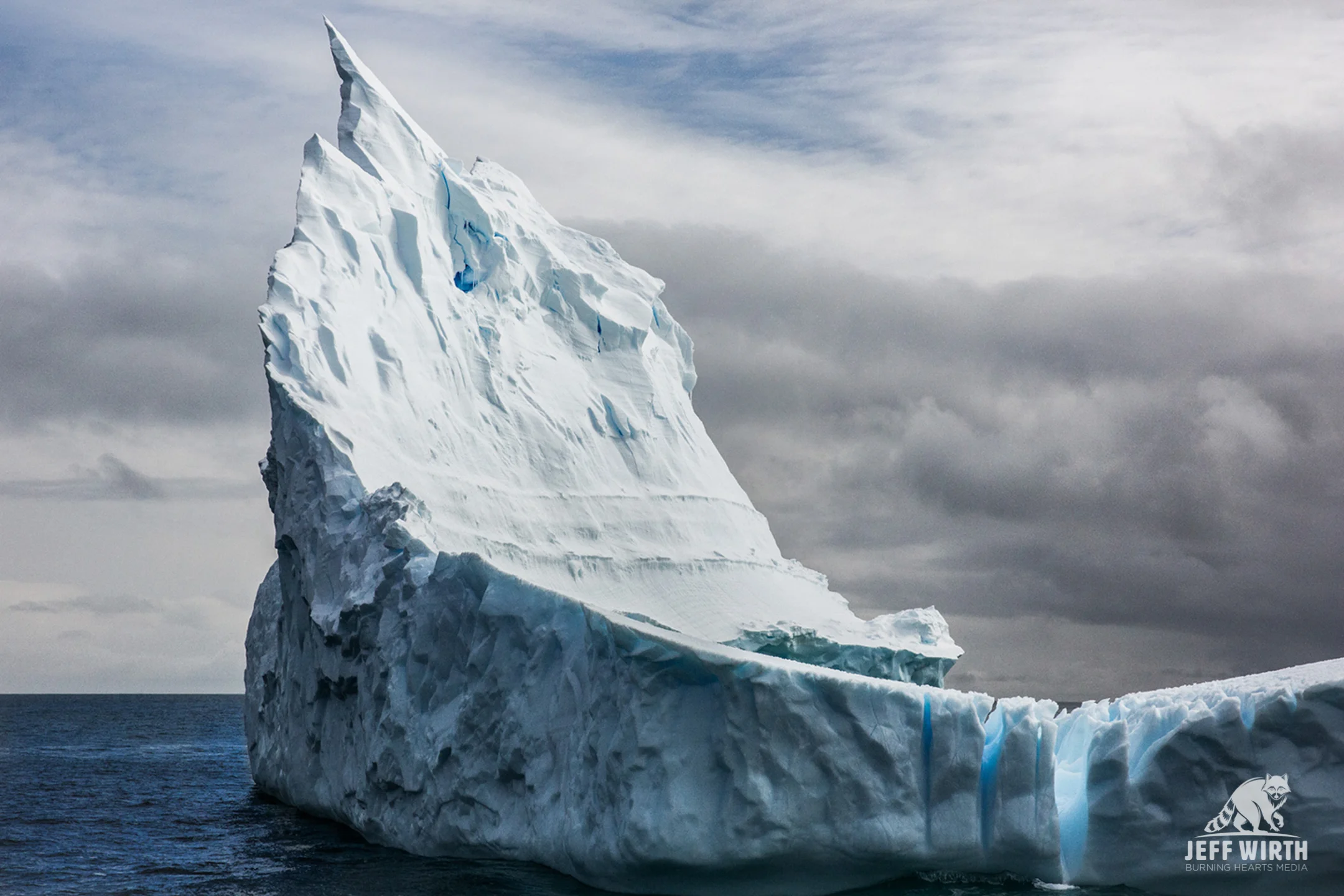 A massive iceberg floats by in the southern ocean, Antarctica.