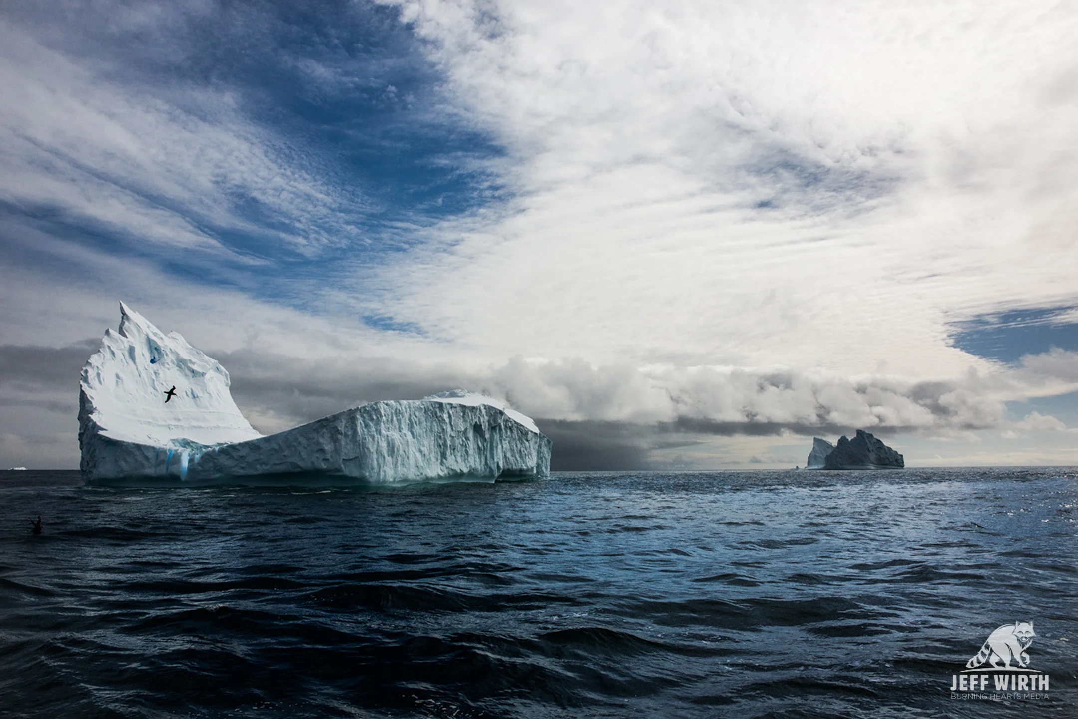 A massive iceberg floats by in the southern ocean, Antarctica.