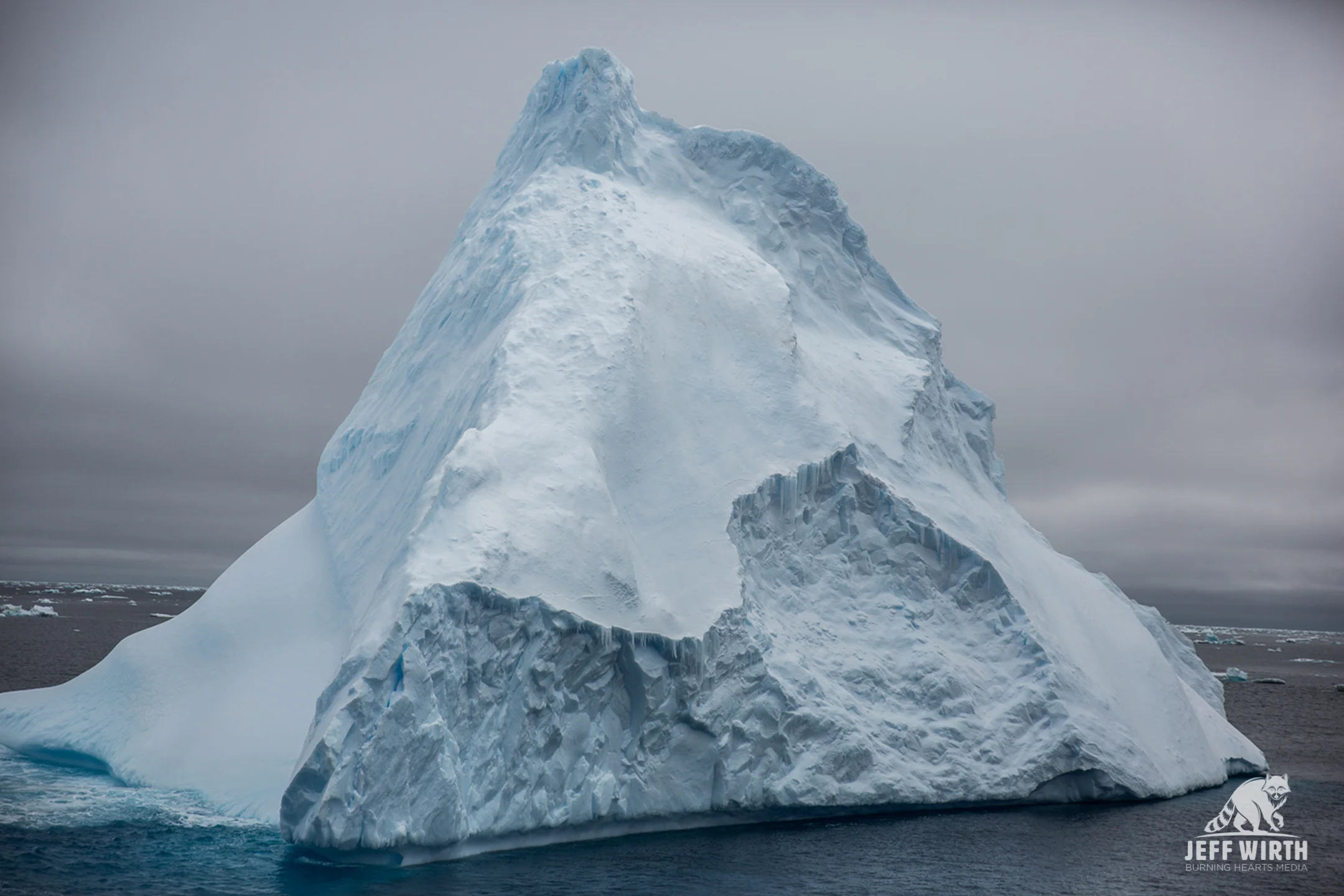A massive iceberg floats by in the southern ocean, Antarctica.
