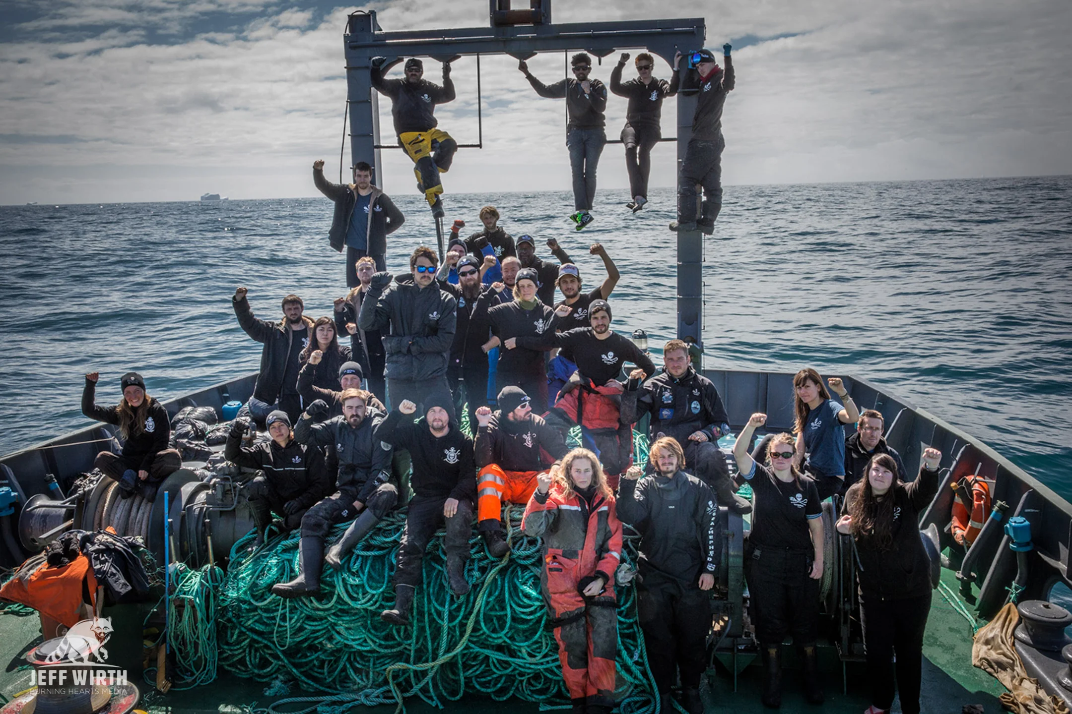 The crew of the MV Sam Simon celebrate as all of the remaining net from the poaching vessel Thunder has been retrieved.