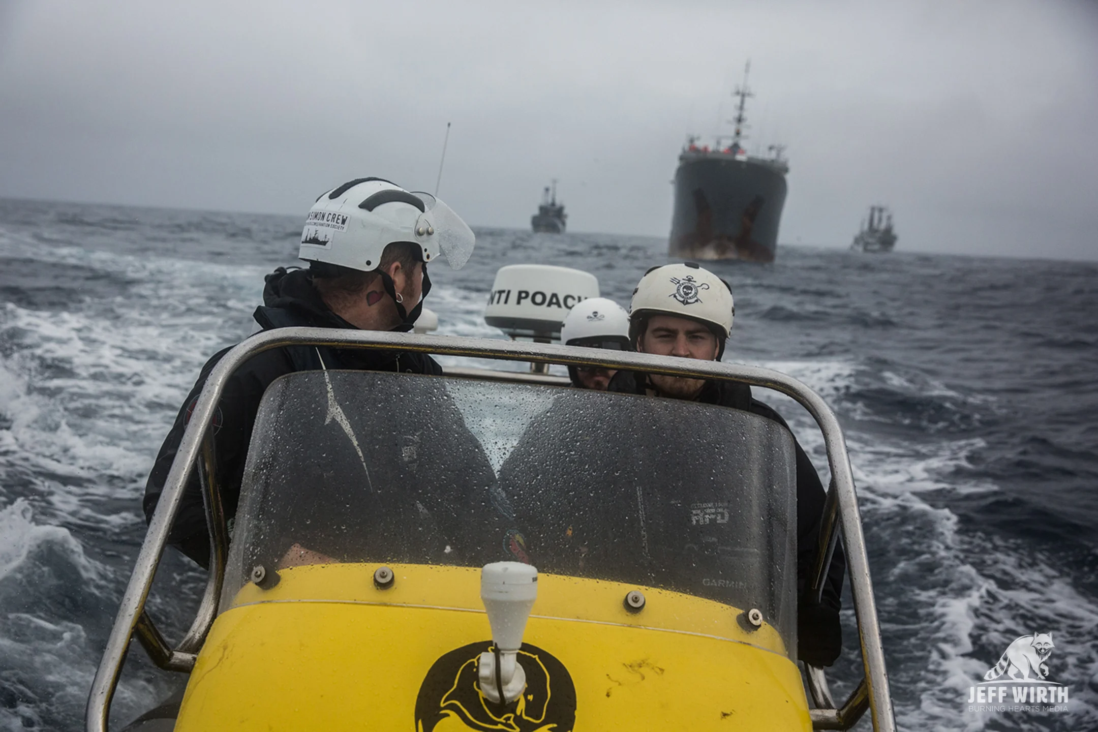 MV Sam Simon small boat team looking back at the poaching vessel Thunder with Sea Shepherd ships in hot pursuit.