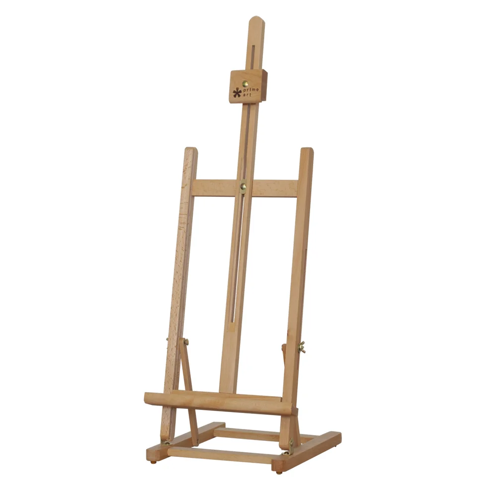 H-FRAME TABLE EASEL 4BE336414 • Size: 27.5x32x75(94)cm. • H style frame. • Beechwood. • Varnished. • Hold canvas up to 56cm. . • Adjustable height and inclination angle. • Suitable for small drawings, painting studies or display. • Assembly required.