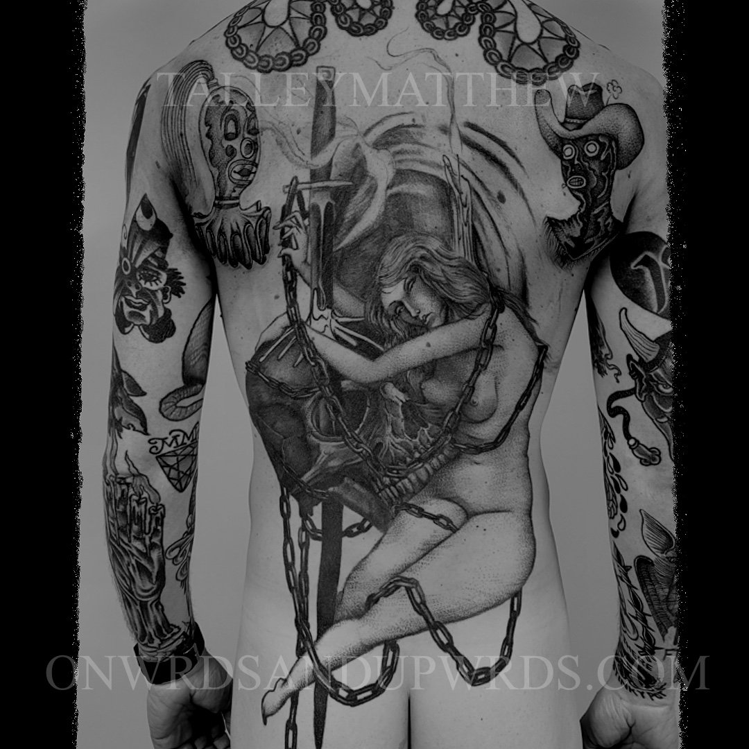 Back piece of a woman and skull