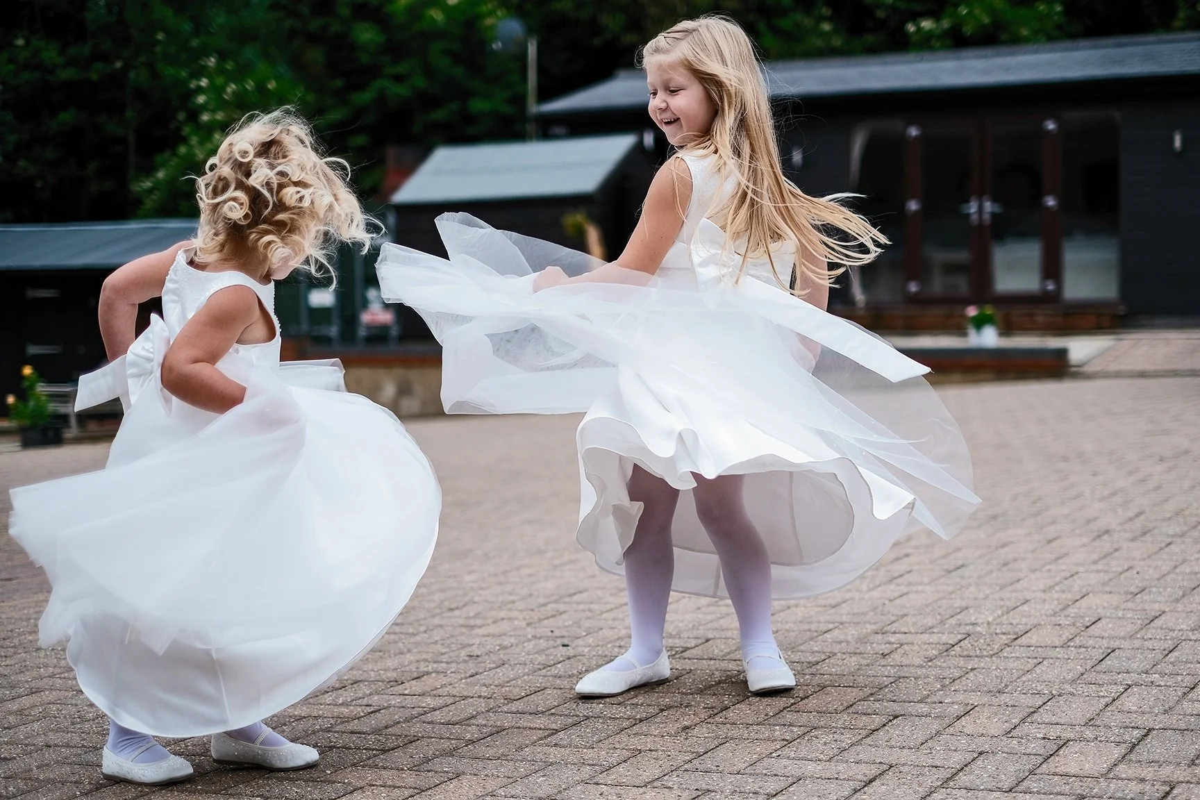 Bridesmaids dancing outside at a wedding