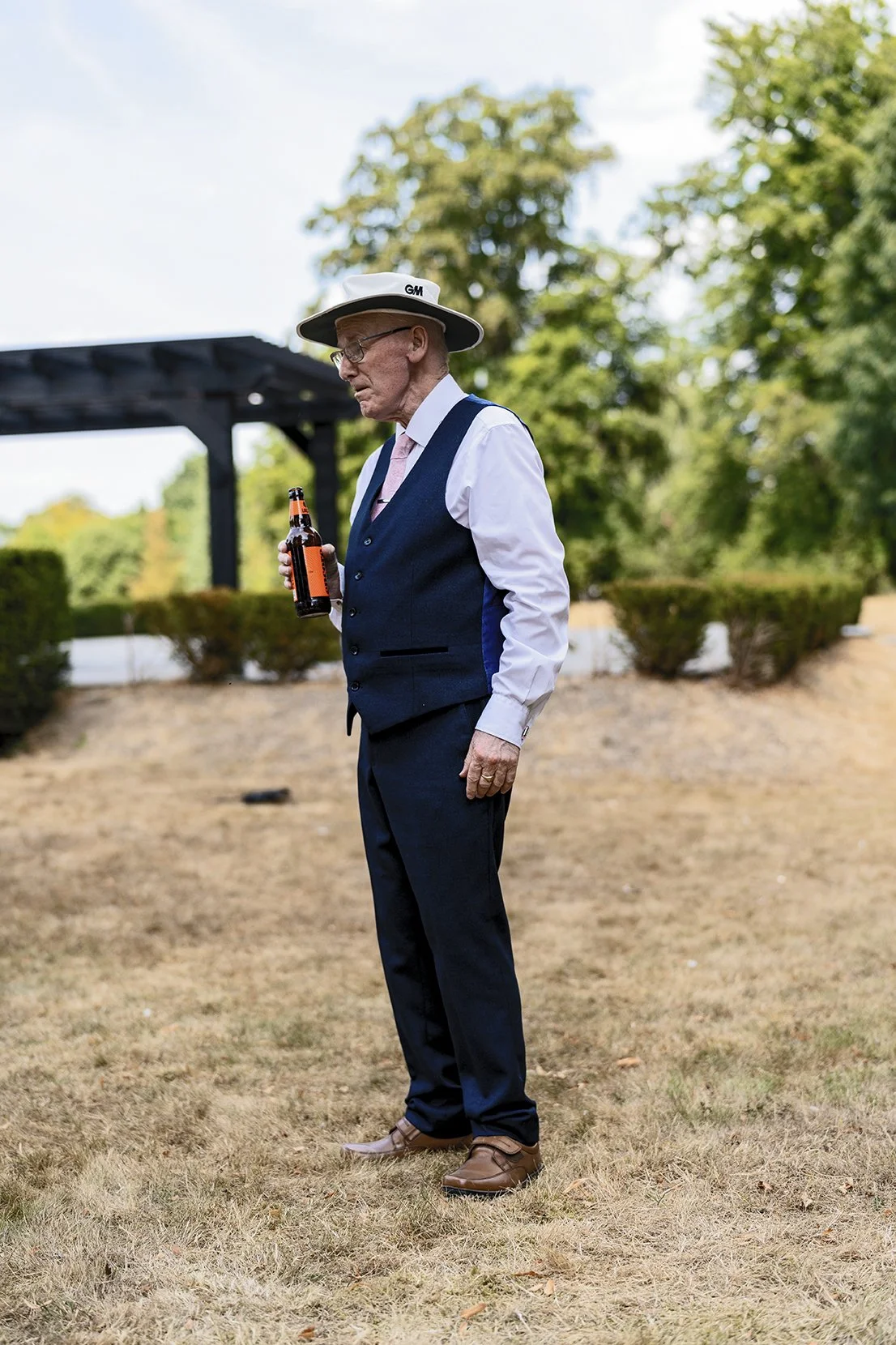 Candid moment of an elderly wedding guests photographed in a documentary style
