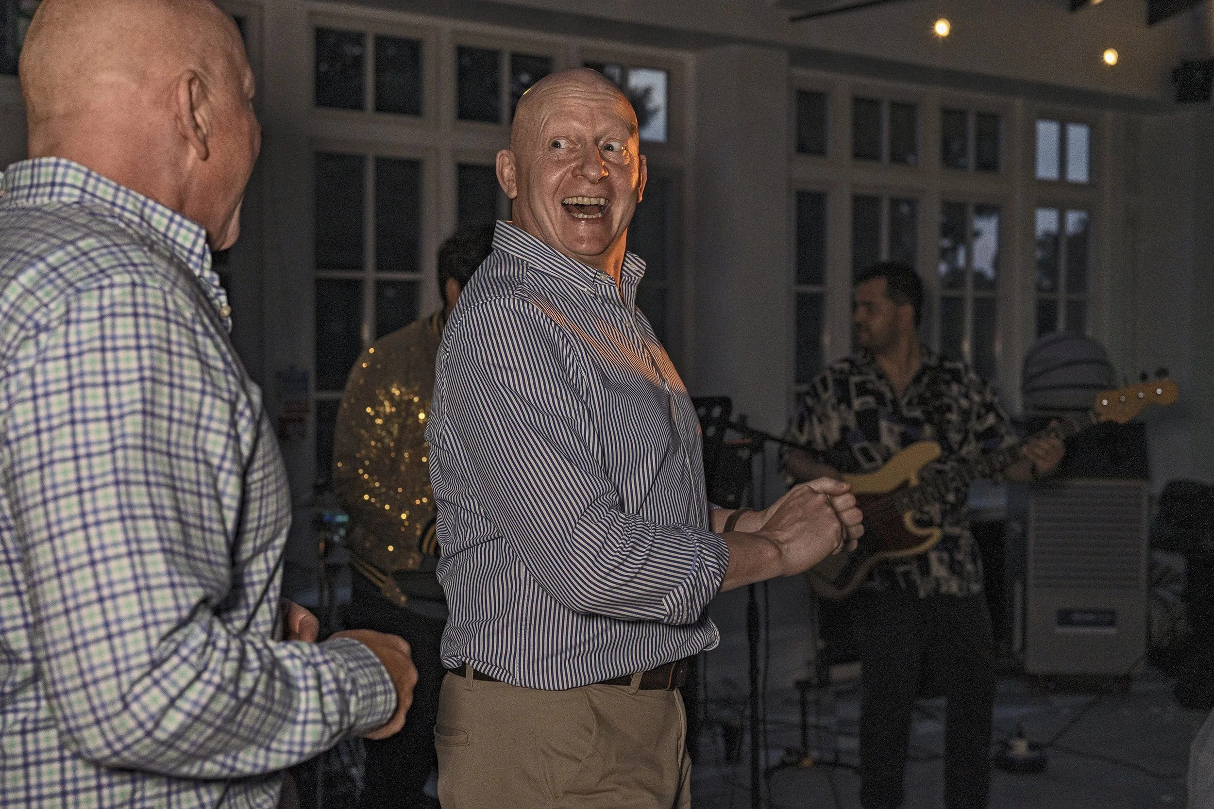 Wedding guests laughing and dancing
