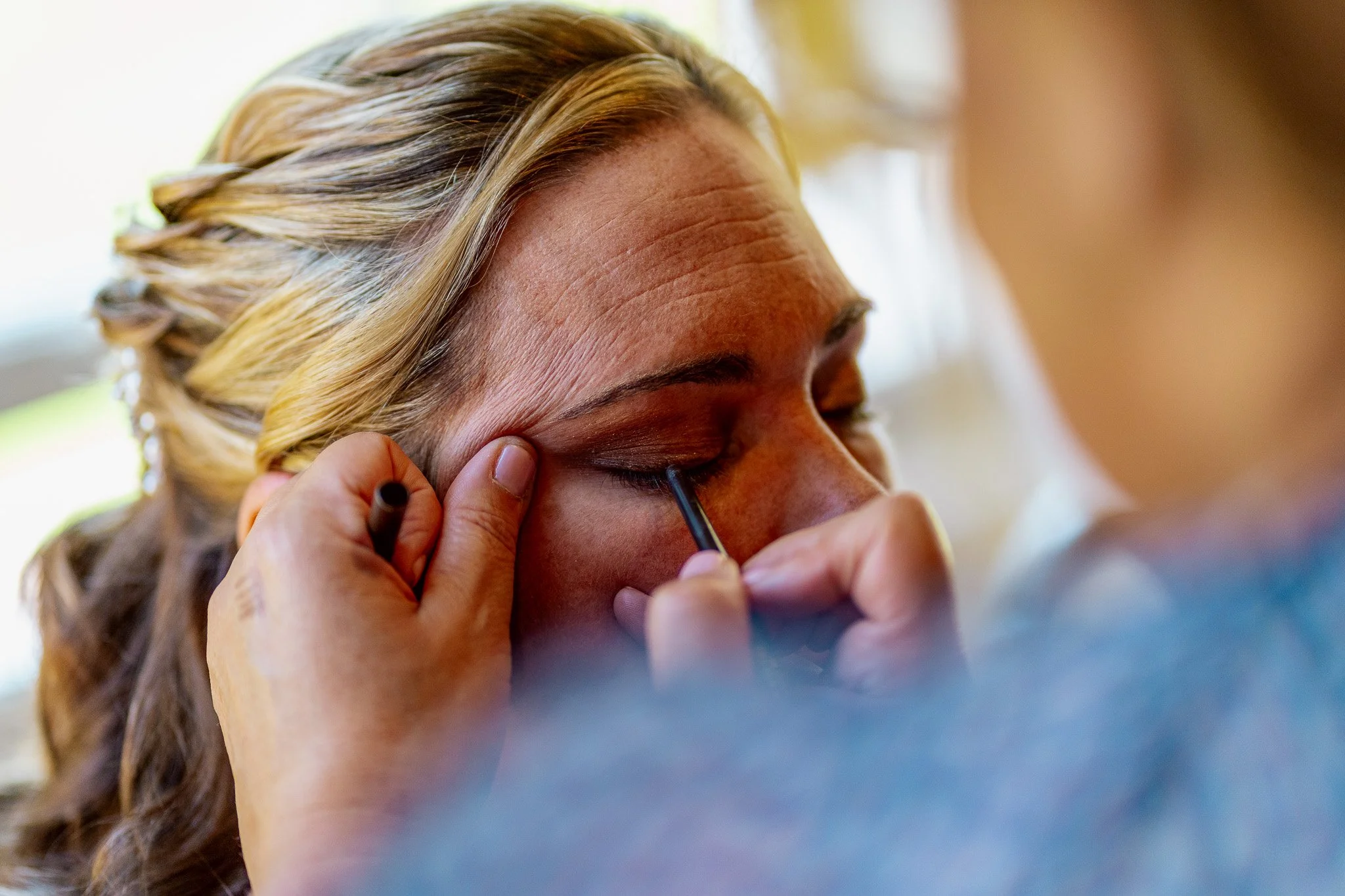 Bride photographed in a candid documentary style during her wedding preparation