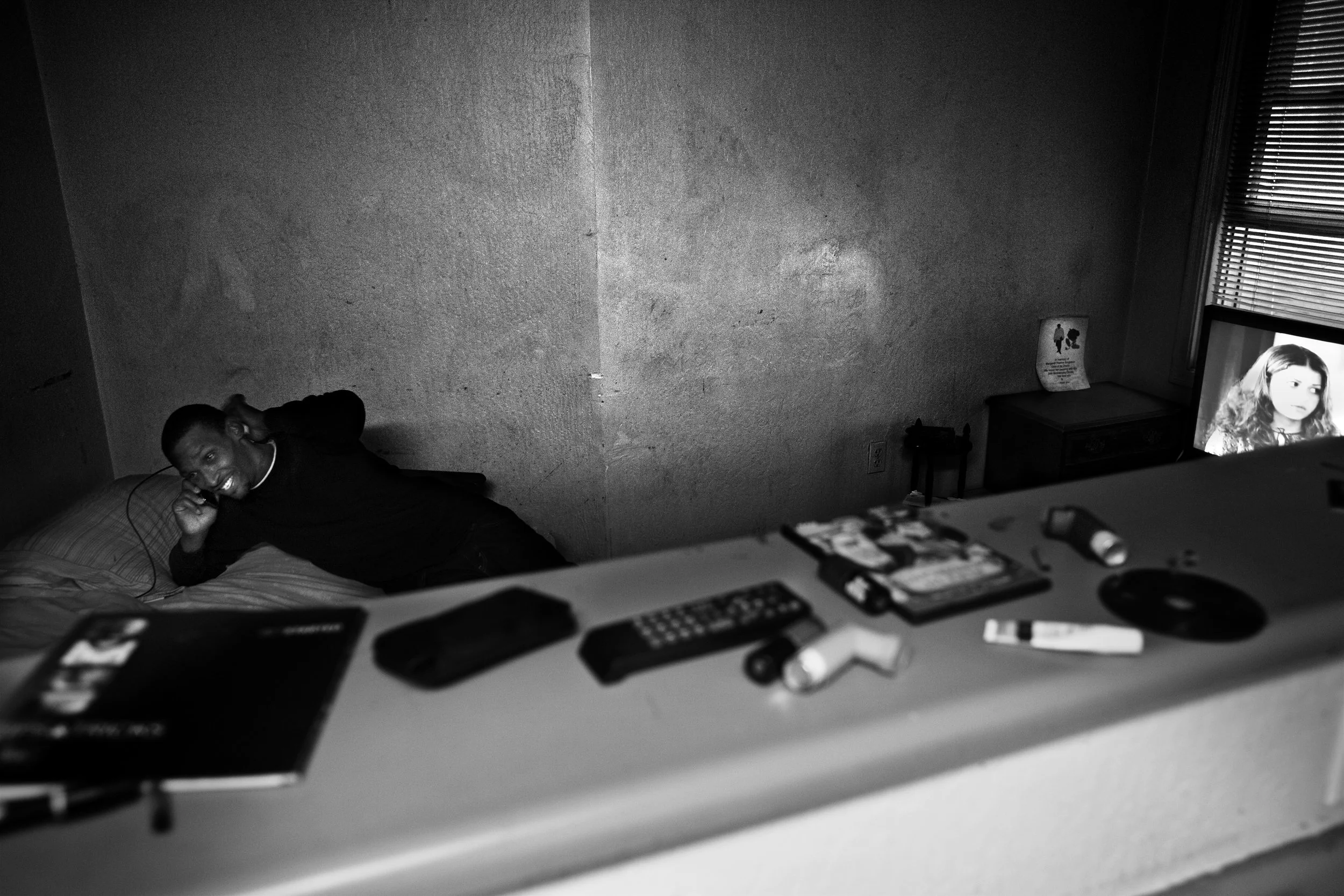  Shanon talks on the phone while staying at a friends apartment in downtown Oakland. 