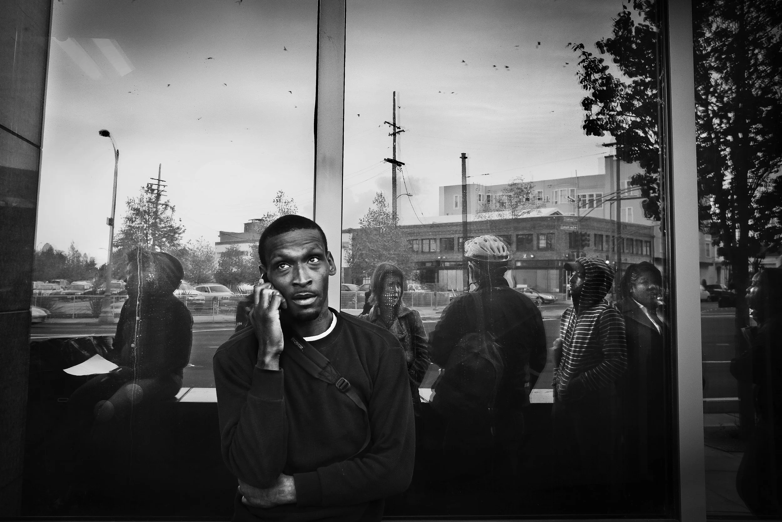  Shanon waits in line to pick up his welfare check at the welfare office in Oakland. 