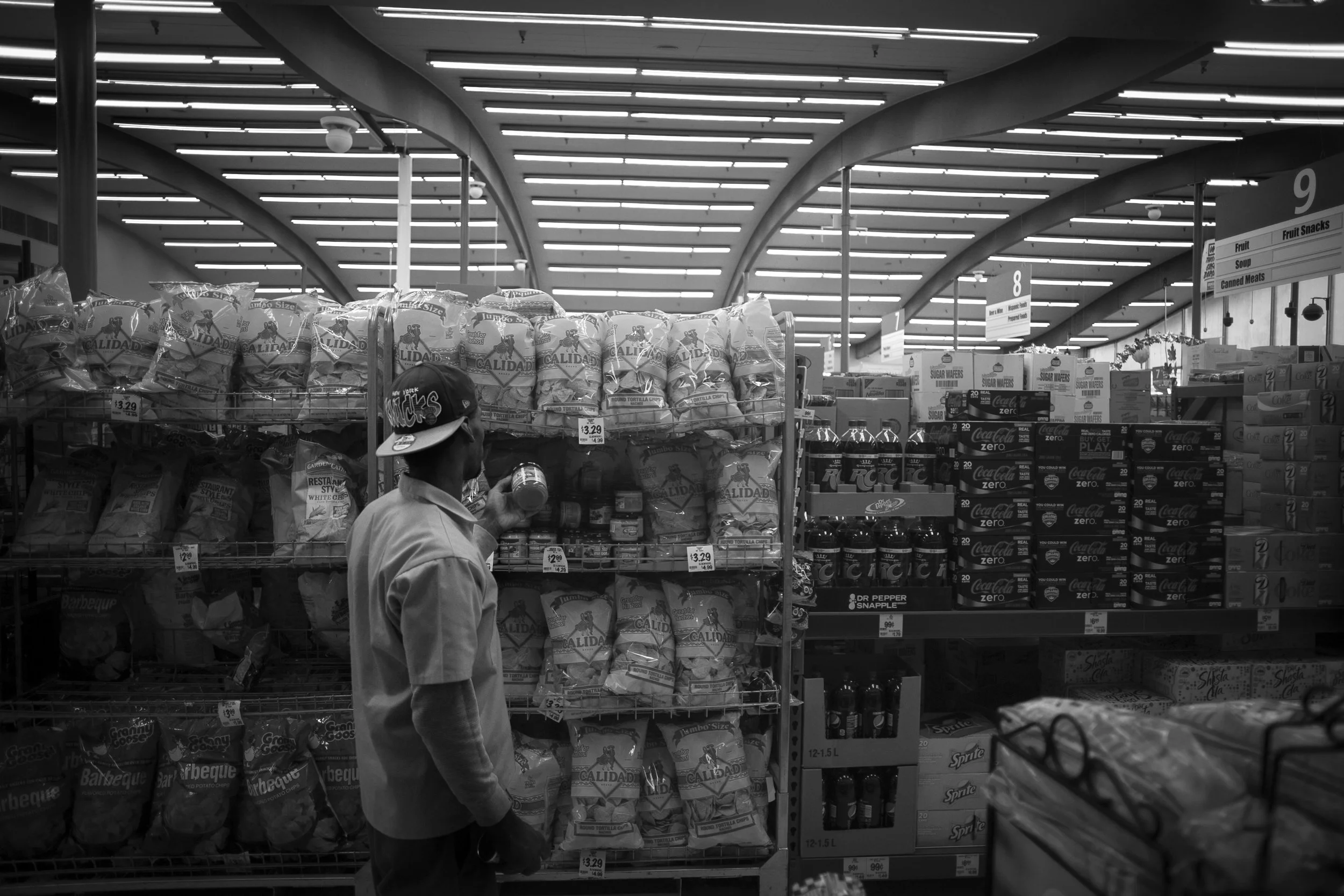  Shanon choses between different salsas while shopping at Grocery Outlet, a Discount Groceries in Oakland. 