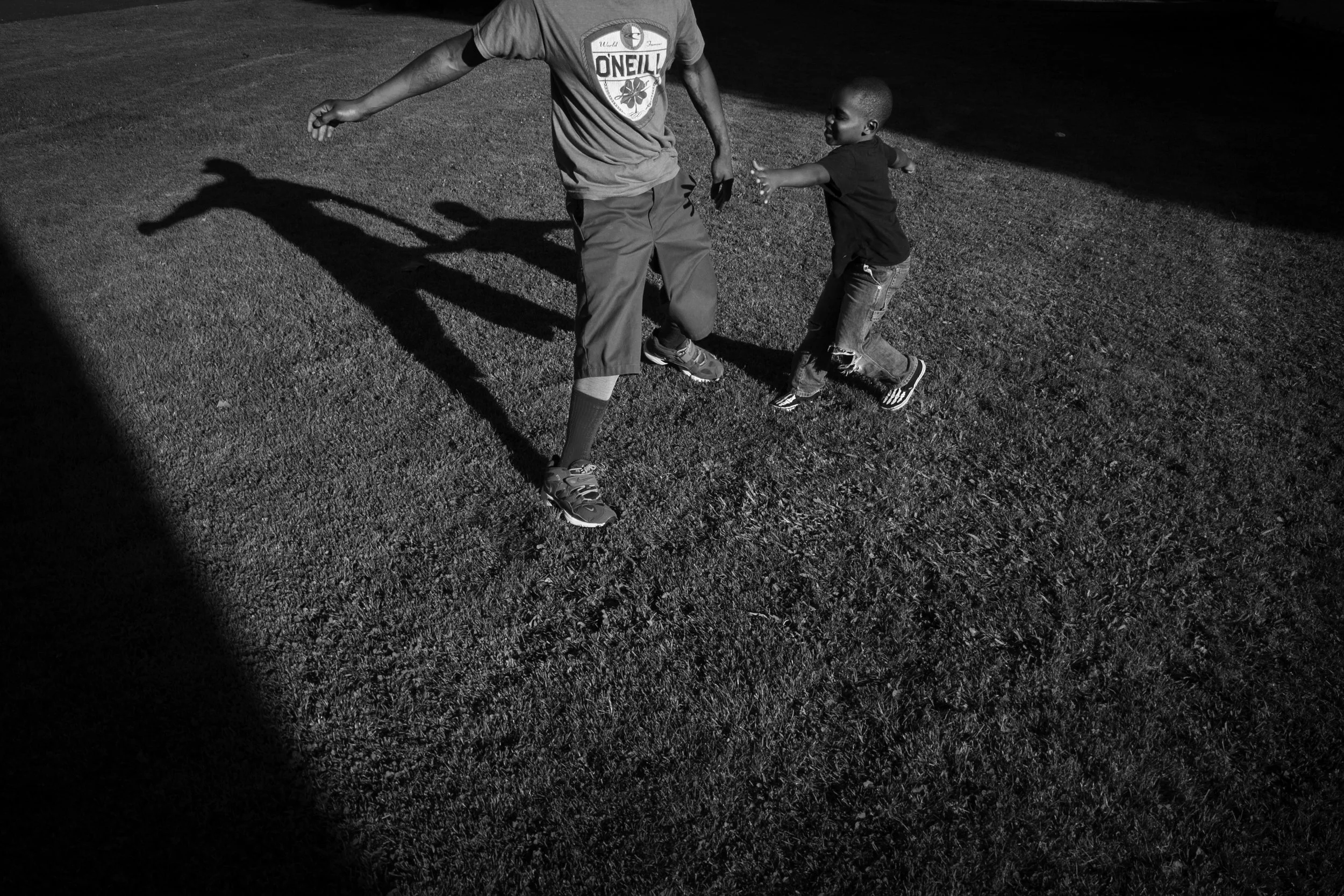  Shanon plays with Jamesha's son in the park in downtown Oakland.  