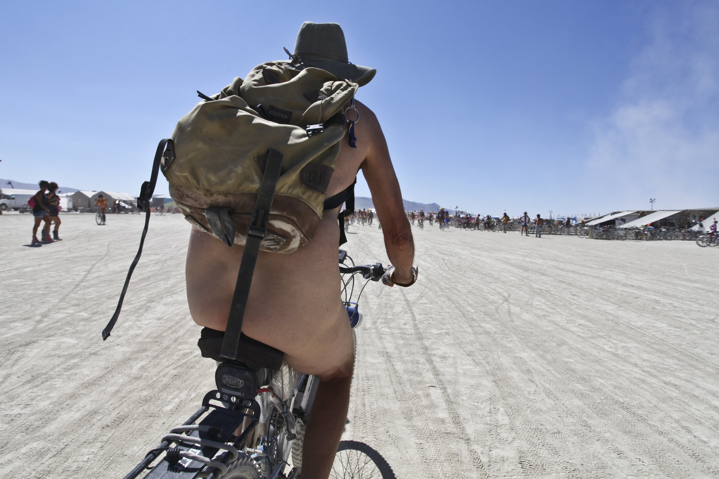  A man rides his bike during one of the many naked bike rides. Nudity in the city is by no means mandatory, both the clothed and unclothed are welcome. 