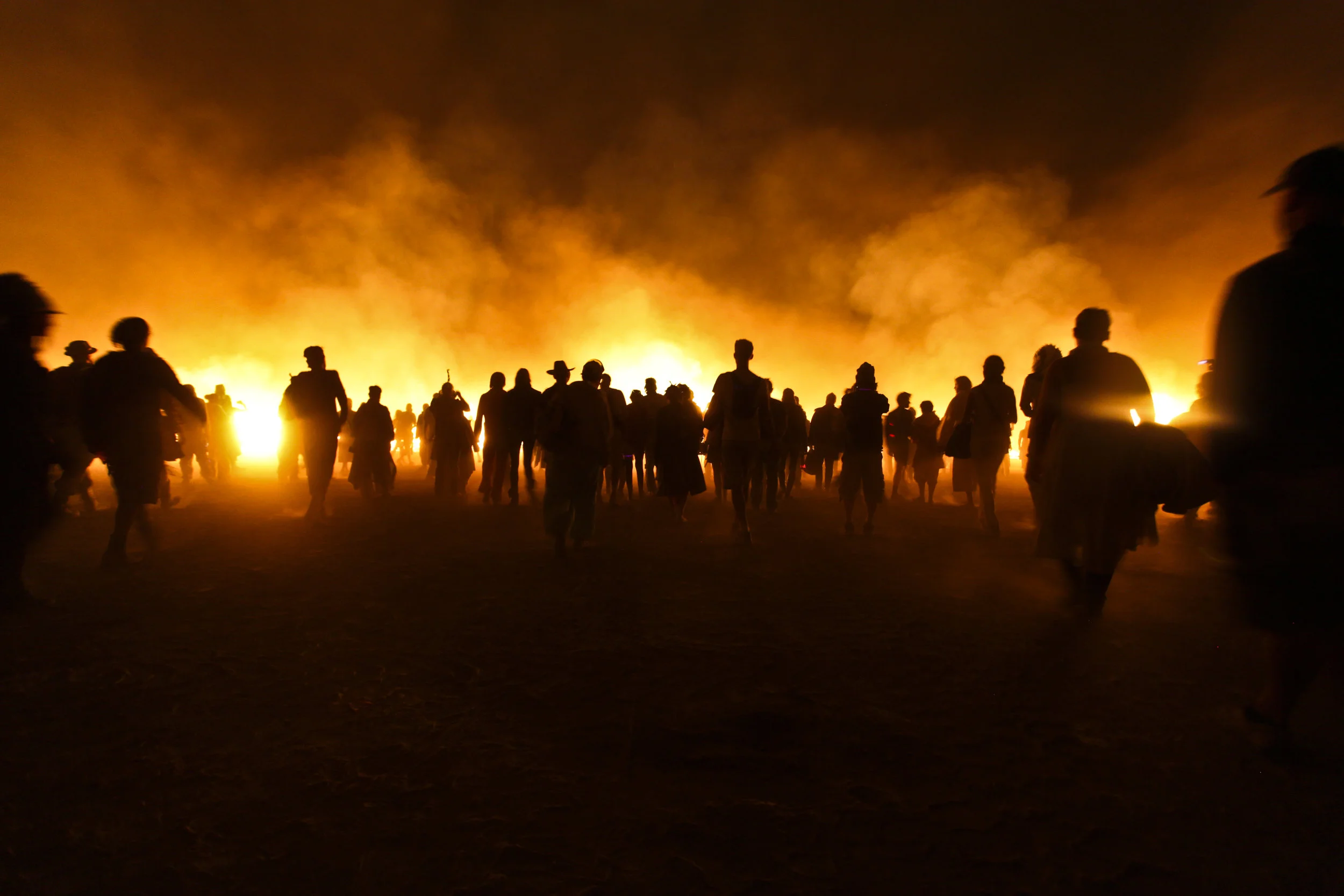  After the final structural elements of the temple fall the crown slowly walks towards the flames. 
