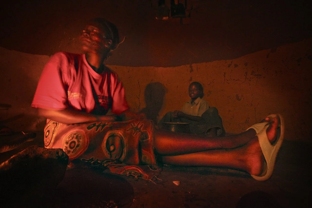  People cook dinner in a hut in a village, located in the region of Bakita in Zimbabwe. The village is about a 40 minute hike from the closest shops. Thousands of Zimbabwean refugees crossed the border to South Africa to escape political turmoil, lac