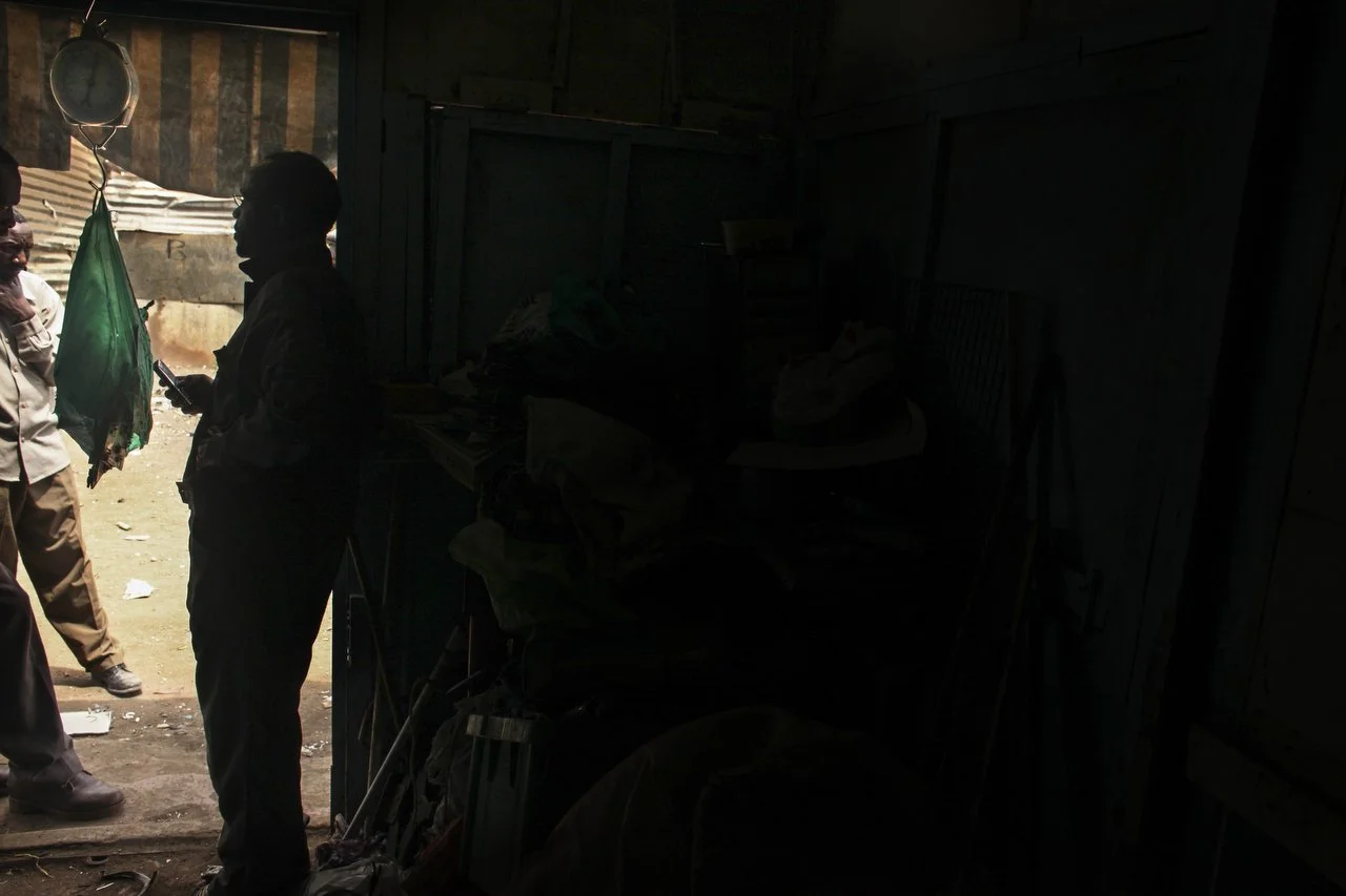  A black market trader in an informal electronics market in Nairobi July 8th 2013. Various registered and unregistered organizations buy electronic chips and motherboards from middle men. 