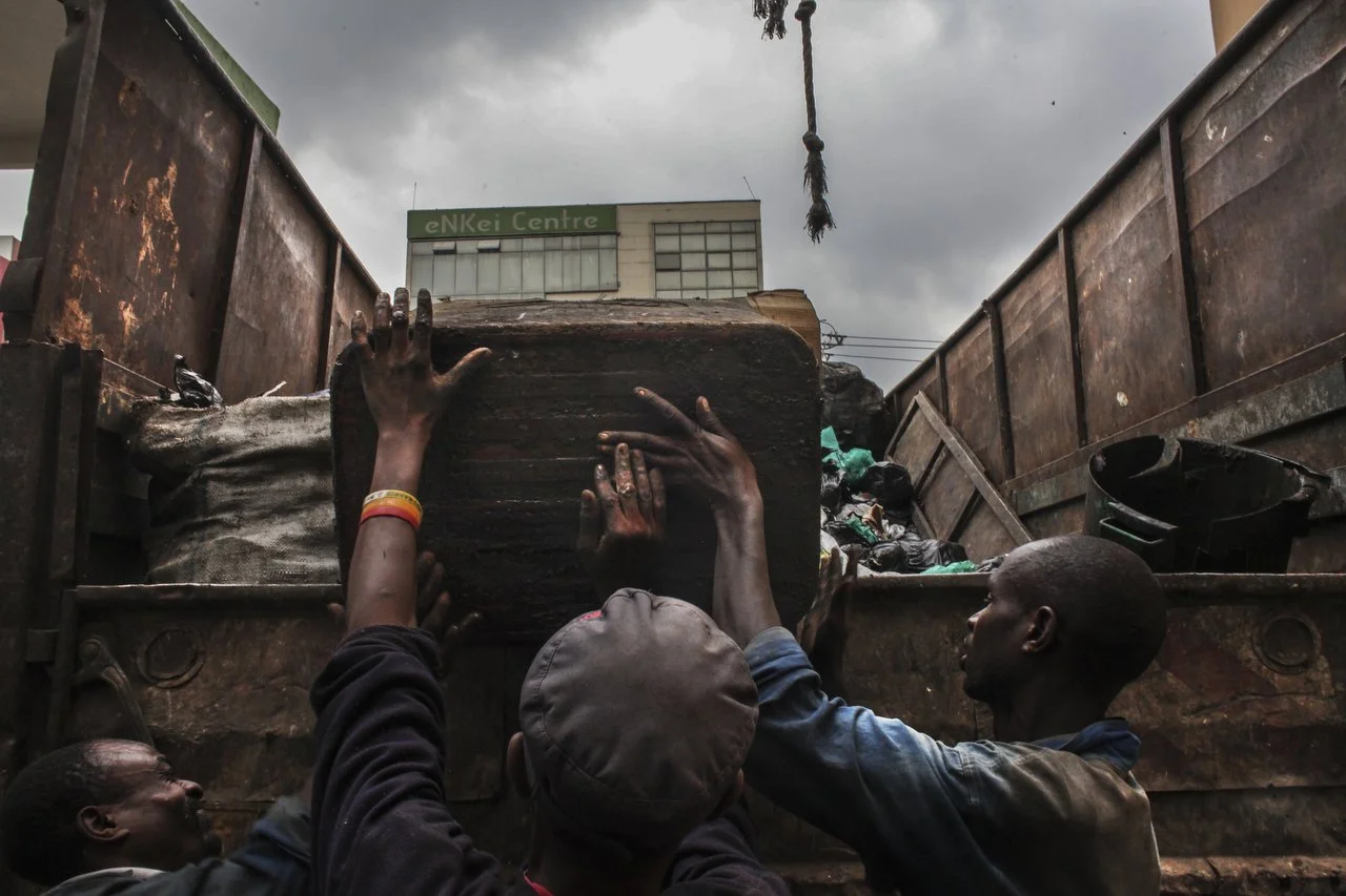  A private trash collection agency collects trash during a trash pickup run in Nairobi on June 29th 2013.  