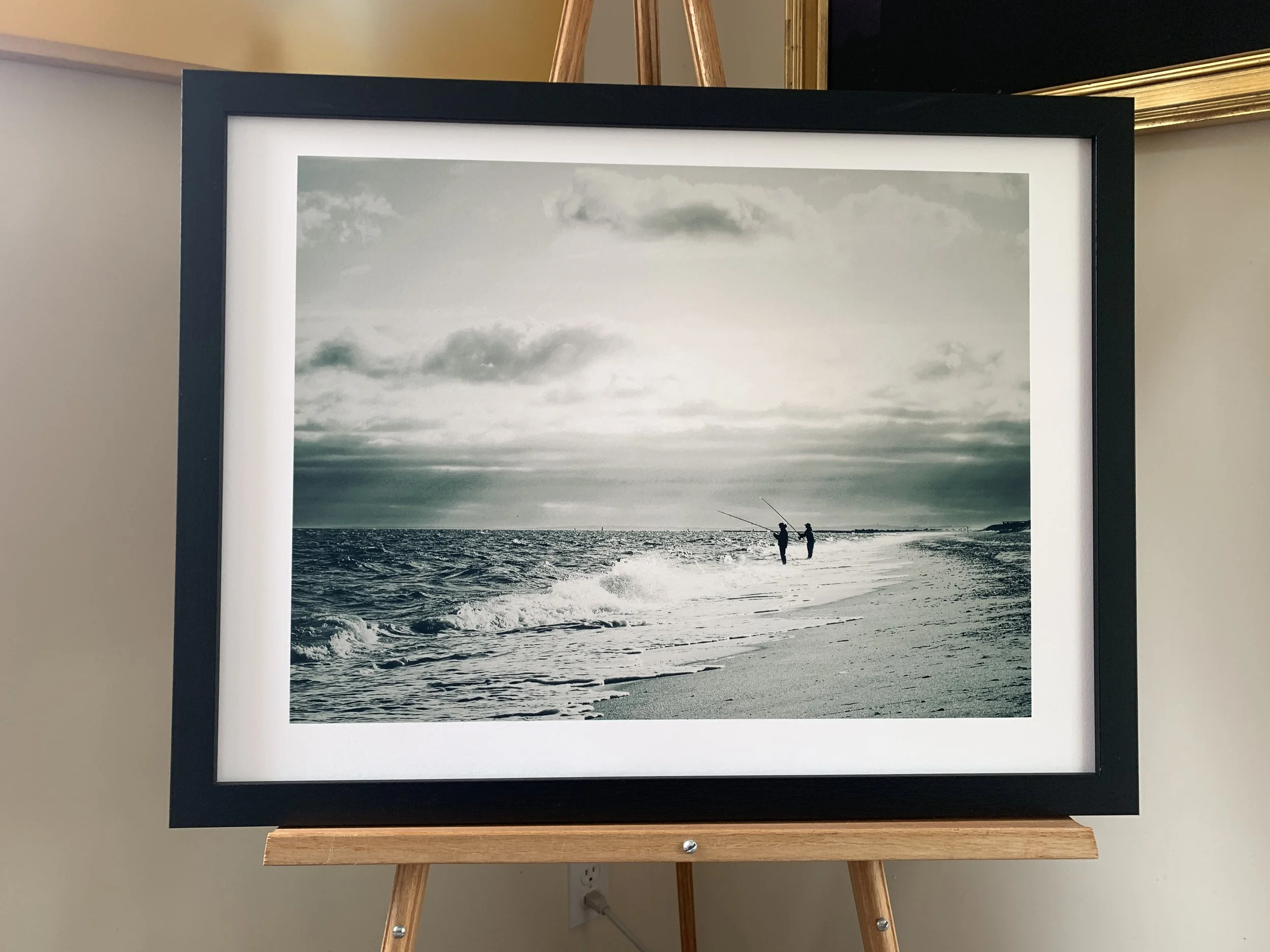 Friends who Fish Together, Katheleen Casey.  18x24 pigment ink print on rag paper. Pressed in a black wood frame by backing board. $200
