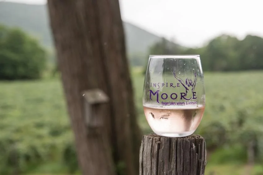 Inspire Moore wine glass overlooks the vineyard. Photo: Visit Finger Lakes