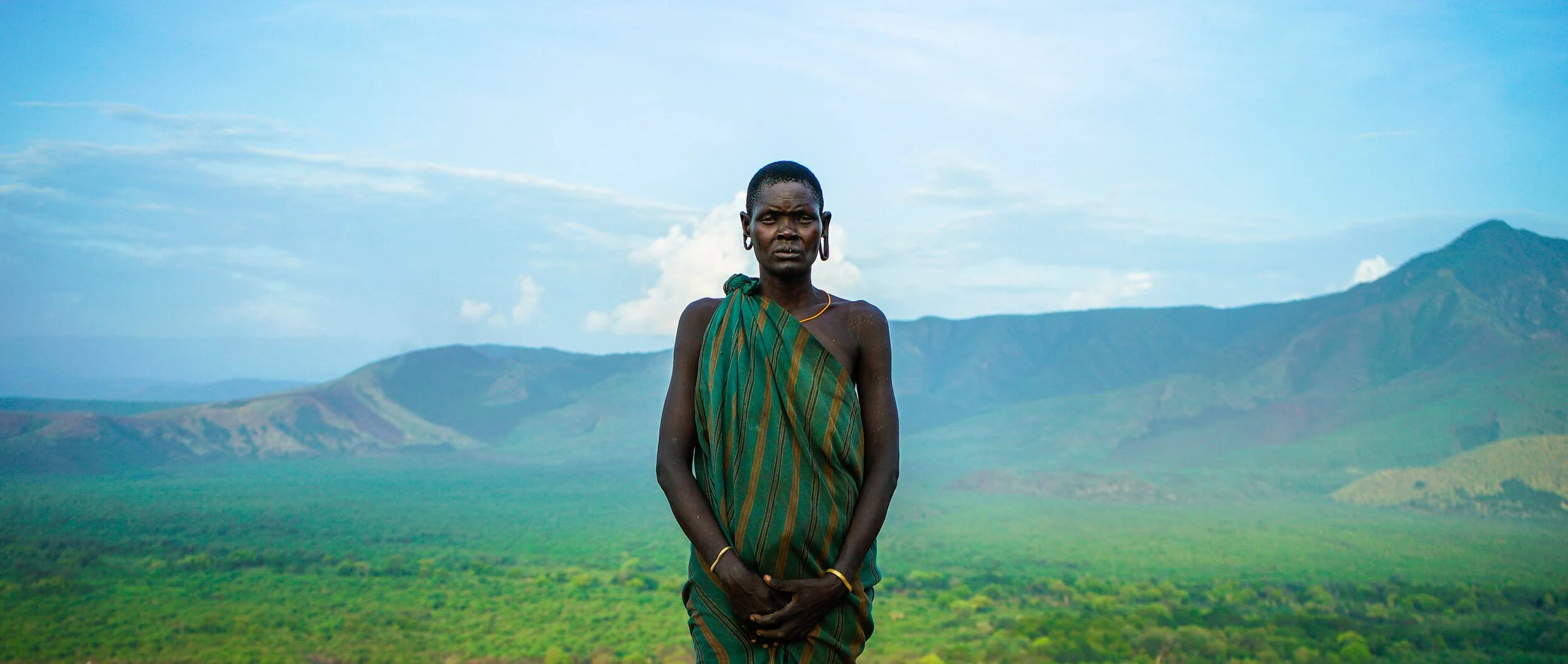 1-TitleWideShot-MursiTribe-Woman.jpg