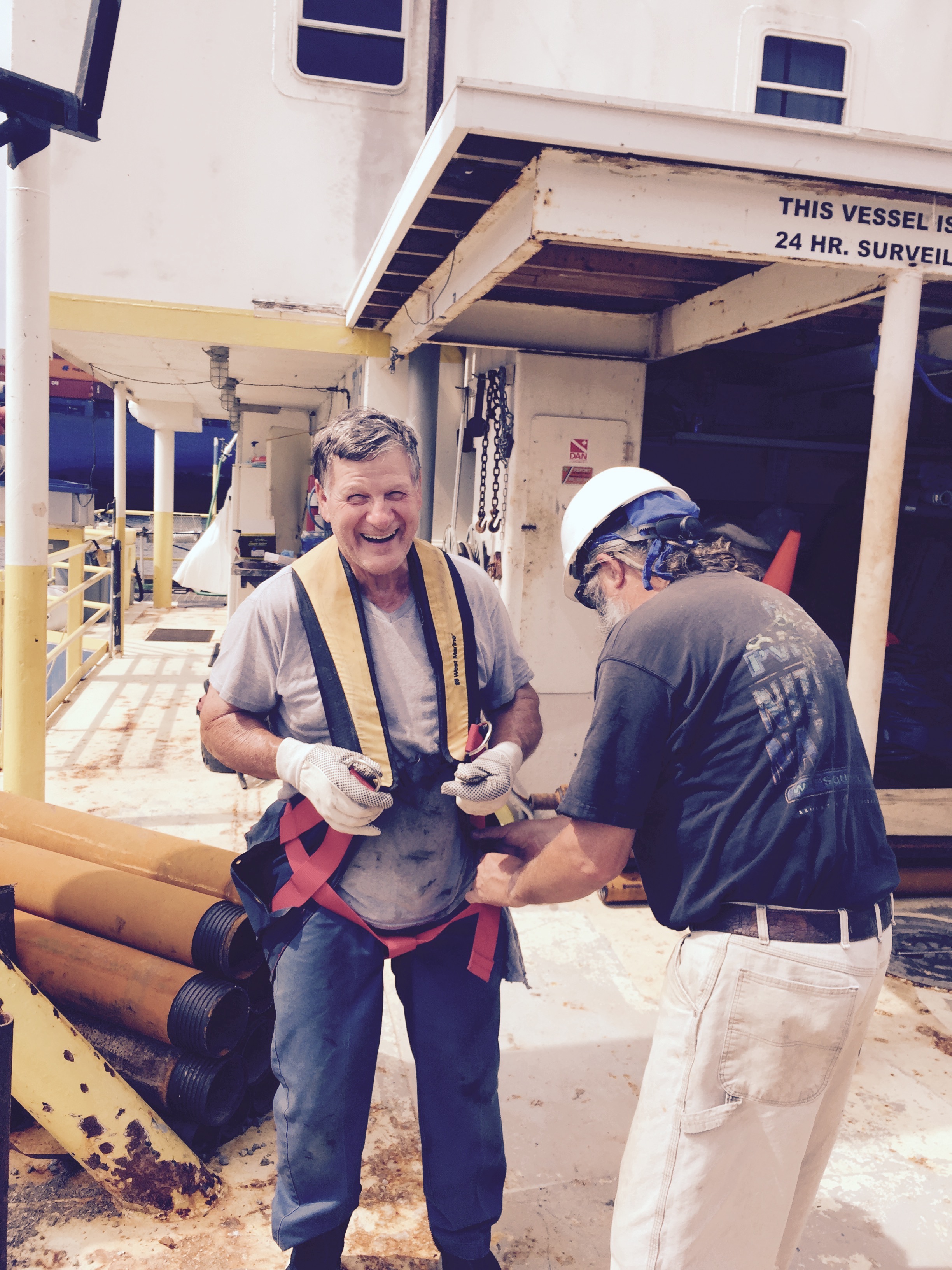 Keith helping Rene in to lifting harness.jpg