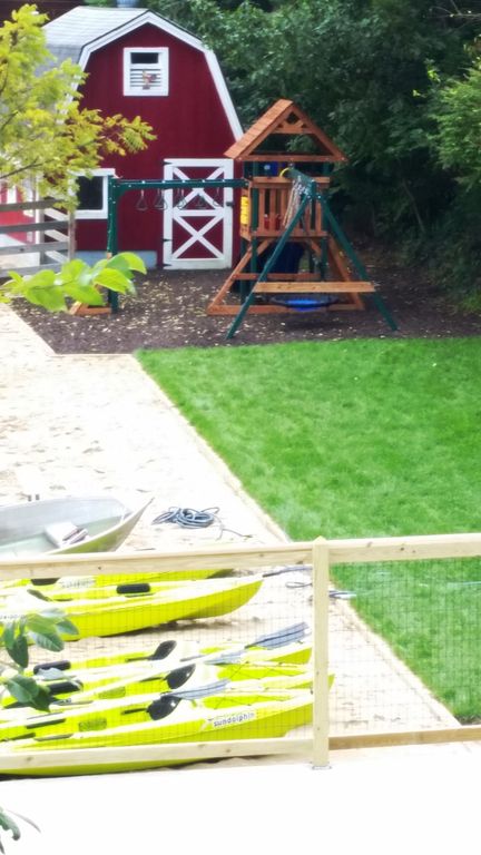 Lawn play area leads to kid's playscape. Barn has 15+ bikes, adults & child sizes