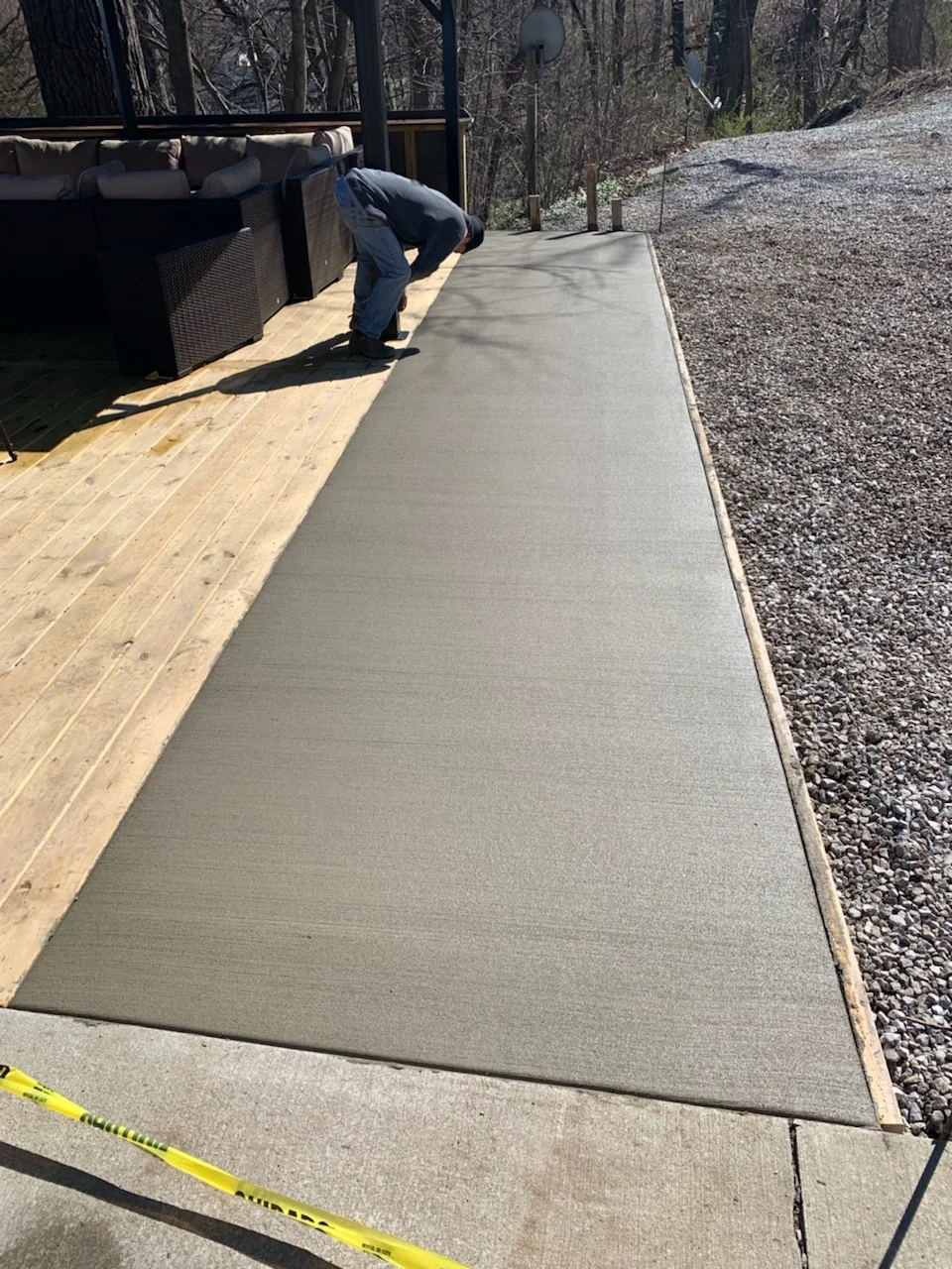 Deck extension connecting to the front of Woodlands Lodge to improve accessibility. Poured April 15 2019.