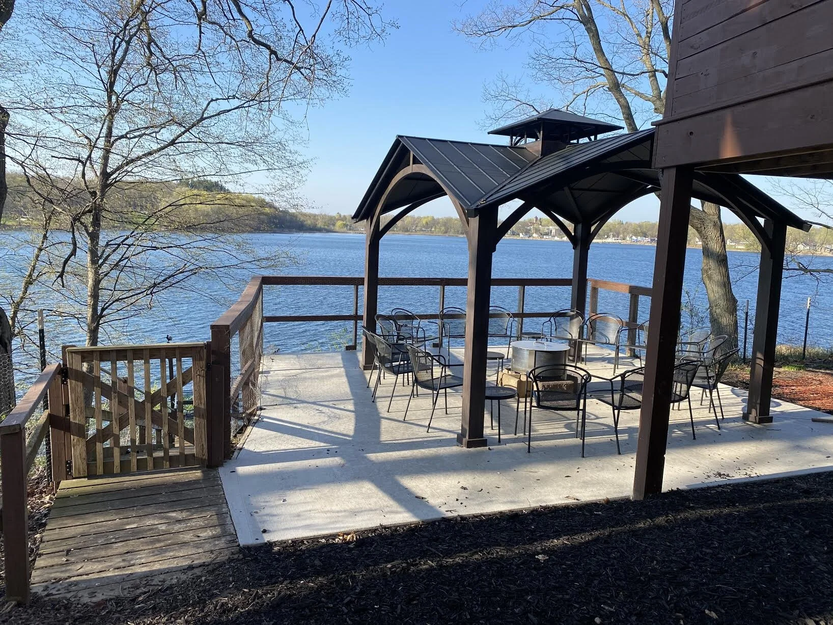 Fire pit features high-end Breeo X series smokeless fire pit. Adjacent firewood shed (not pictured) is super convenient.
