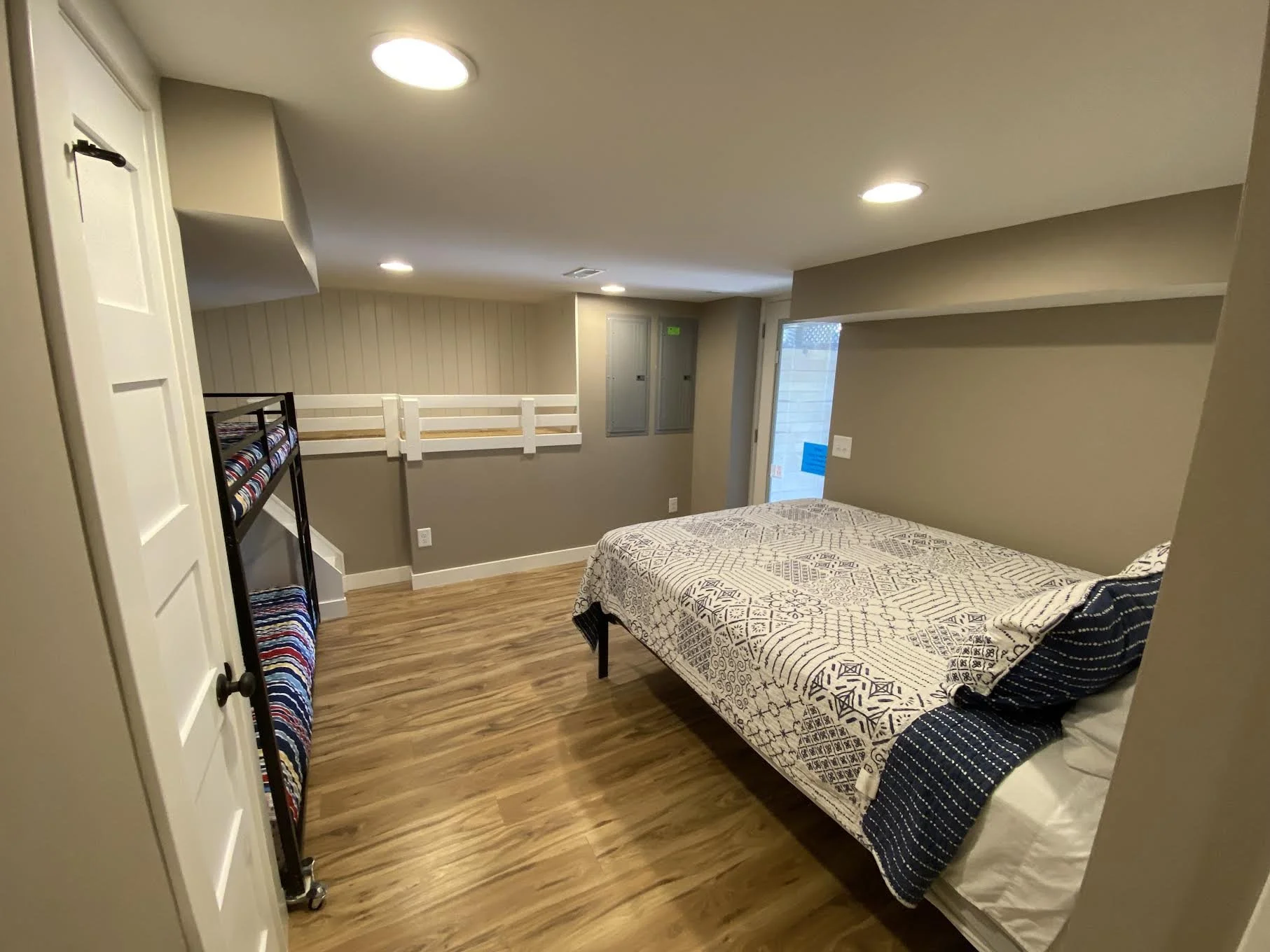 New lower level BR/BA suite has Queen Bed, Twin Bunks, & Kid's Sleeping Loft.