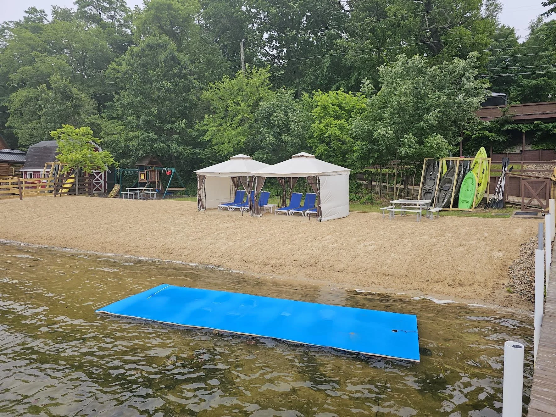 Beach w/ kayaks, lily pad, & new dual cabanas. 12+ bikes in rear red/white shed.