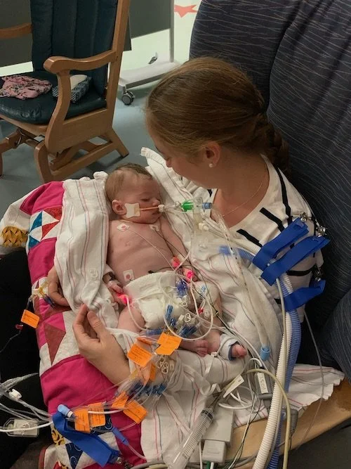 Aubrey hold Tilly.JPG