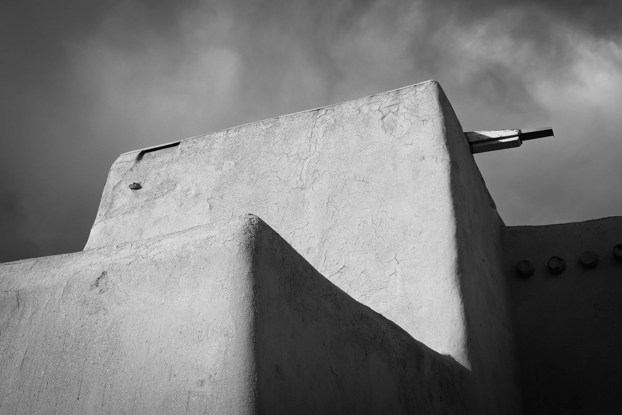 Black and white detail photo of Ranchos de Taos church in New Mexico