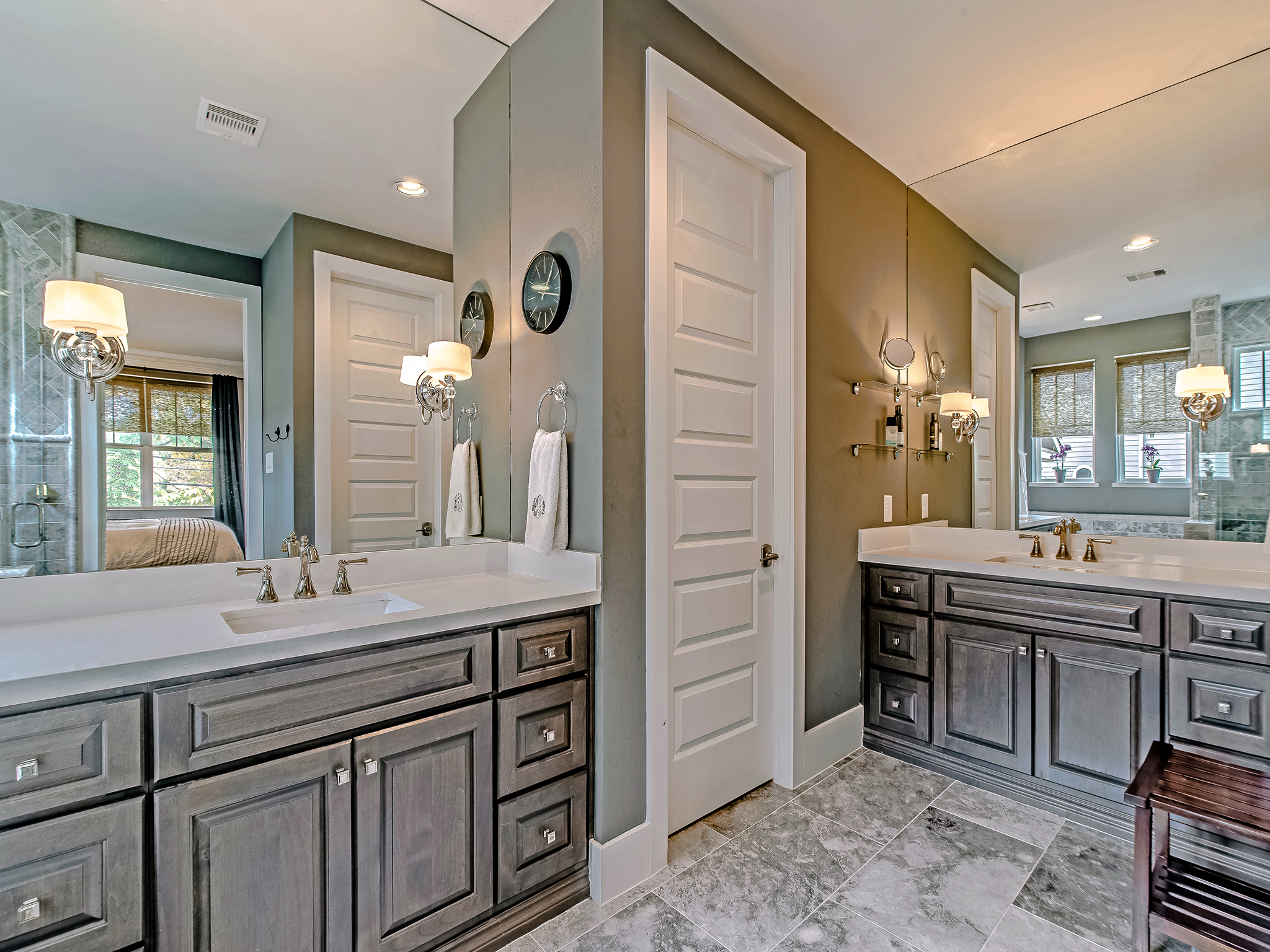 Ensuite master bath with double vanities, soaker tub and shower.