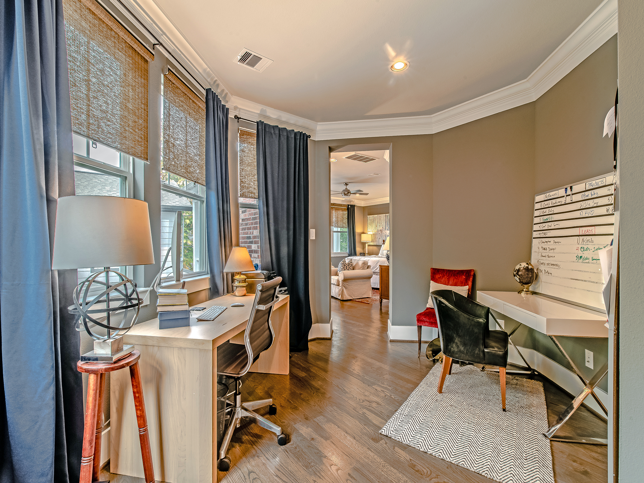 Welcome to your master suite! This seating area is currently being used as a private home office.