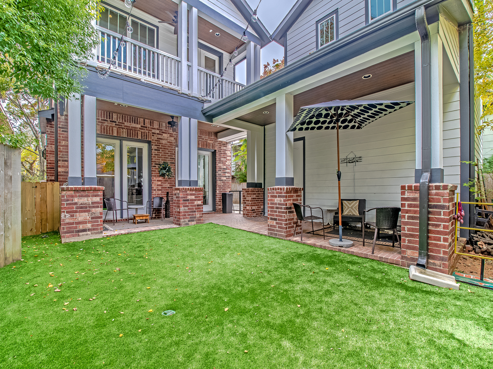This backyard view shows the detached two car garage with ample storage space inside. Also features an unfinished space above the garage that would make a wonderful rental unit, game room or quarters for visitors.