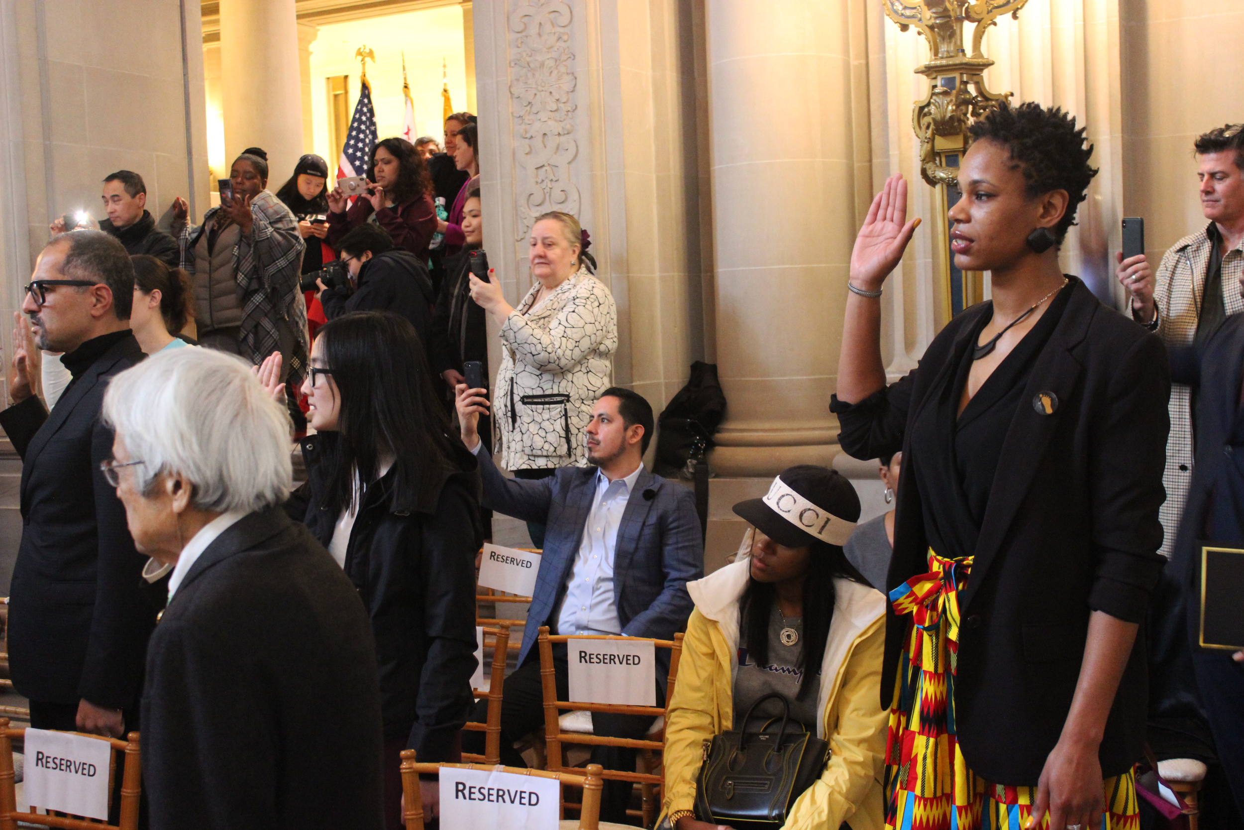 Former Members Audrey Yingwei Xu and Nadiyah Shereff taking the Oath of Office