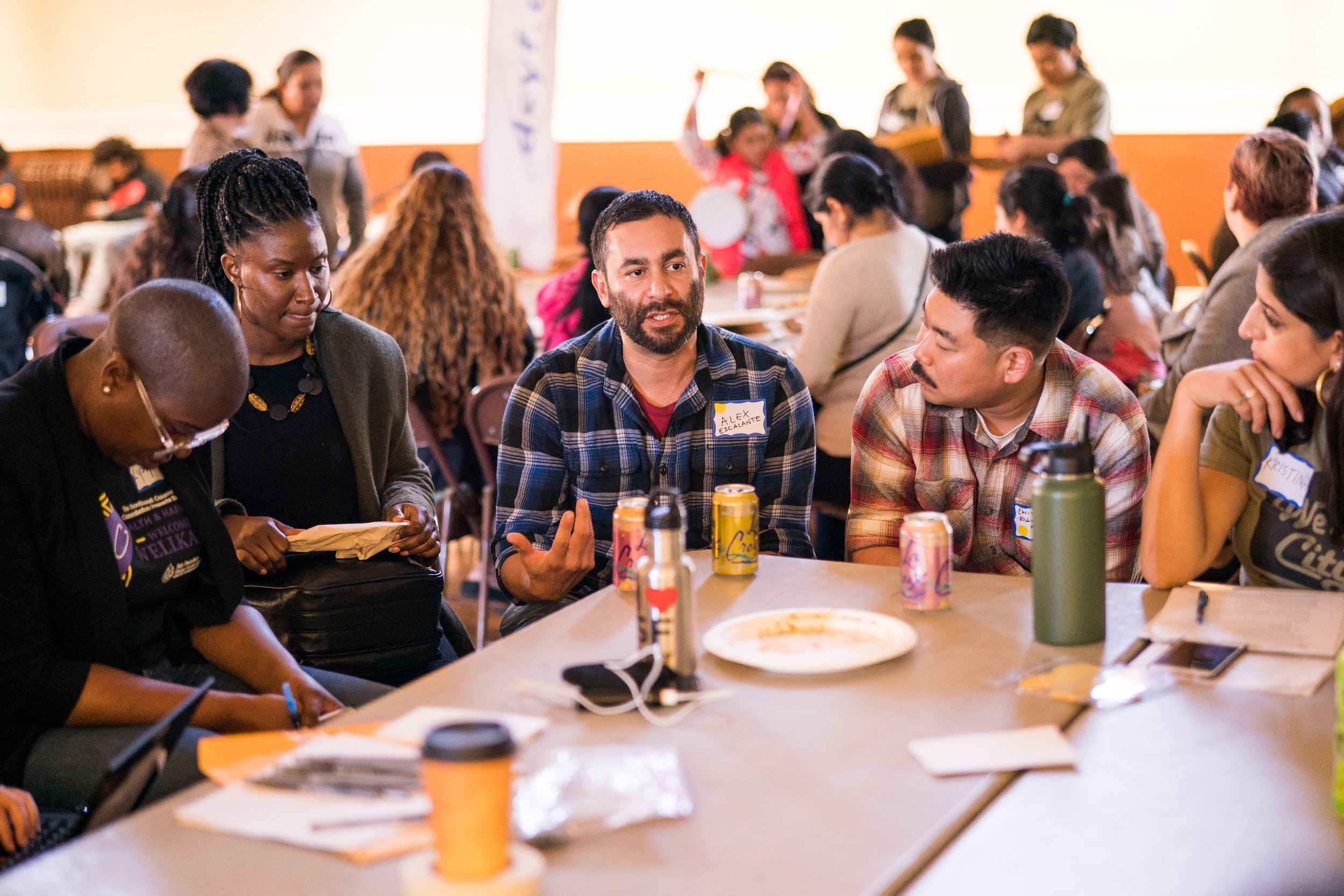 Lyslynn Lacoste (far left) and Chris Tsukida (center right) at a Family Summit event