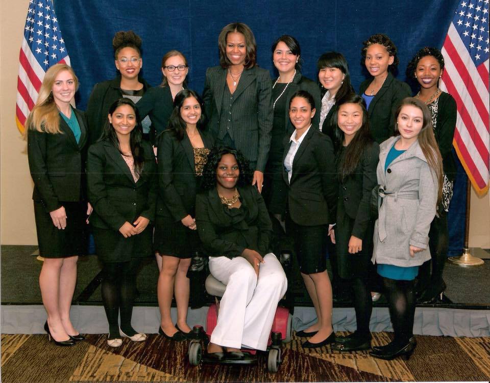 ola ojewumi with Michelle Obama and female volunteers