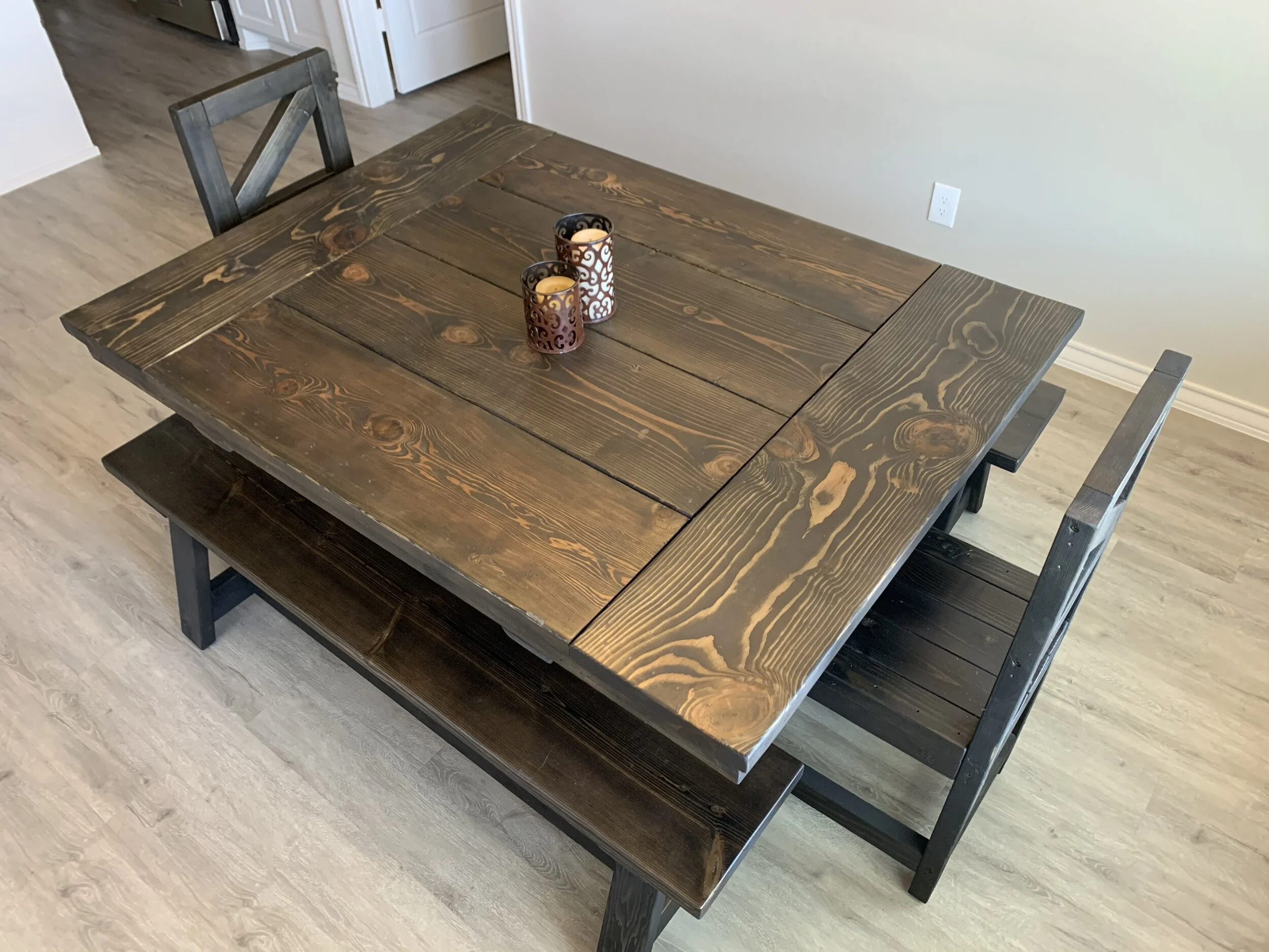 dark breadboard end table with matching chairs and benches.jpeg