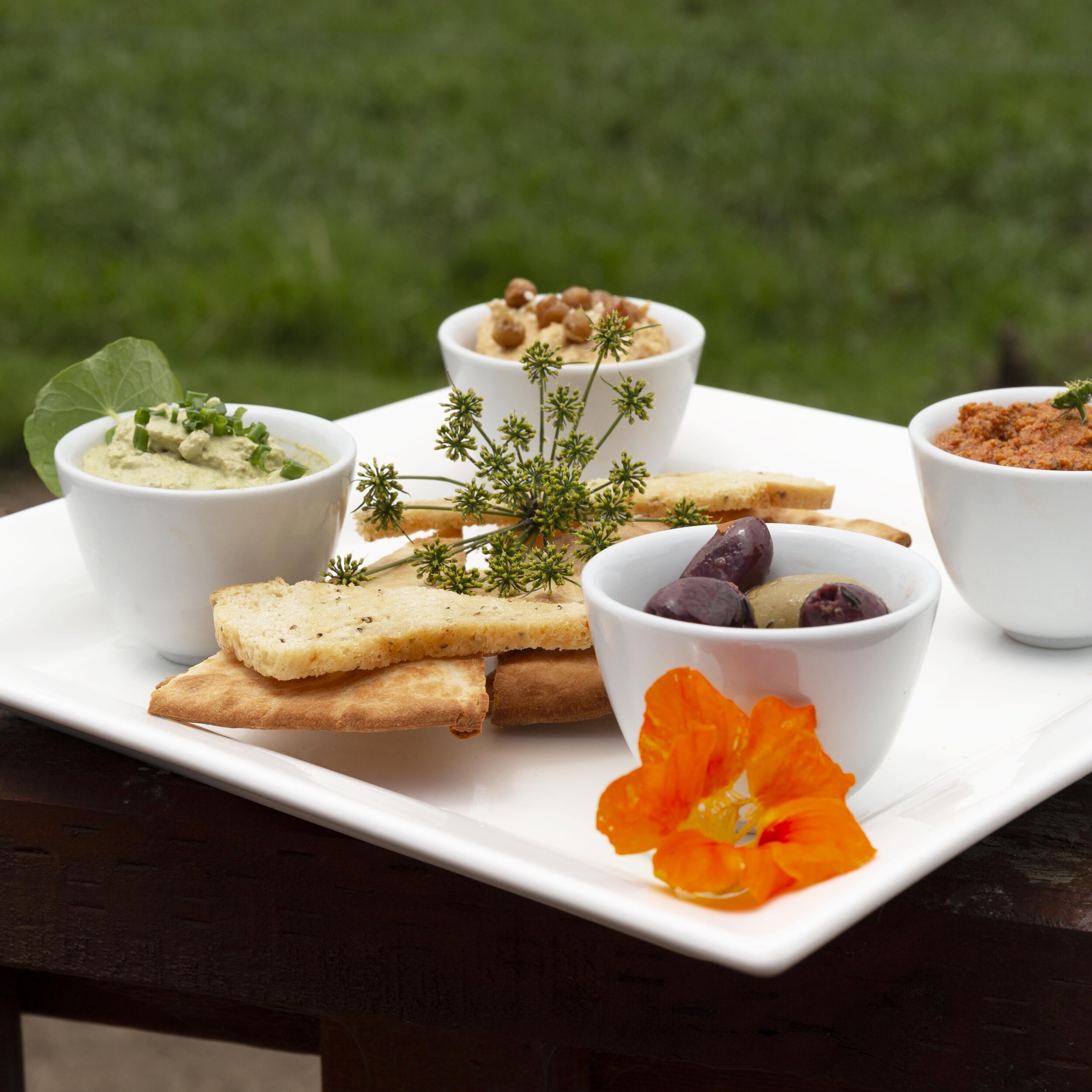 Housemade Dips, Marinated Olives, Variety of Breads - V 