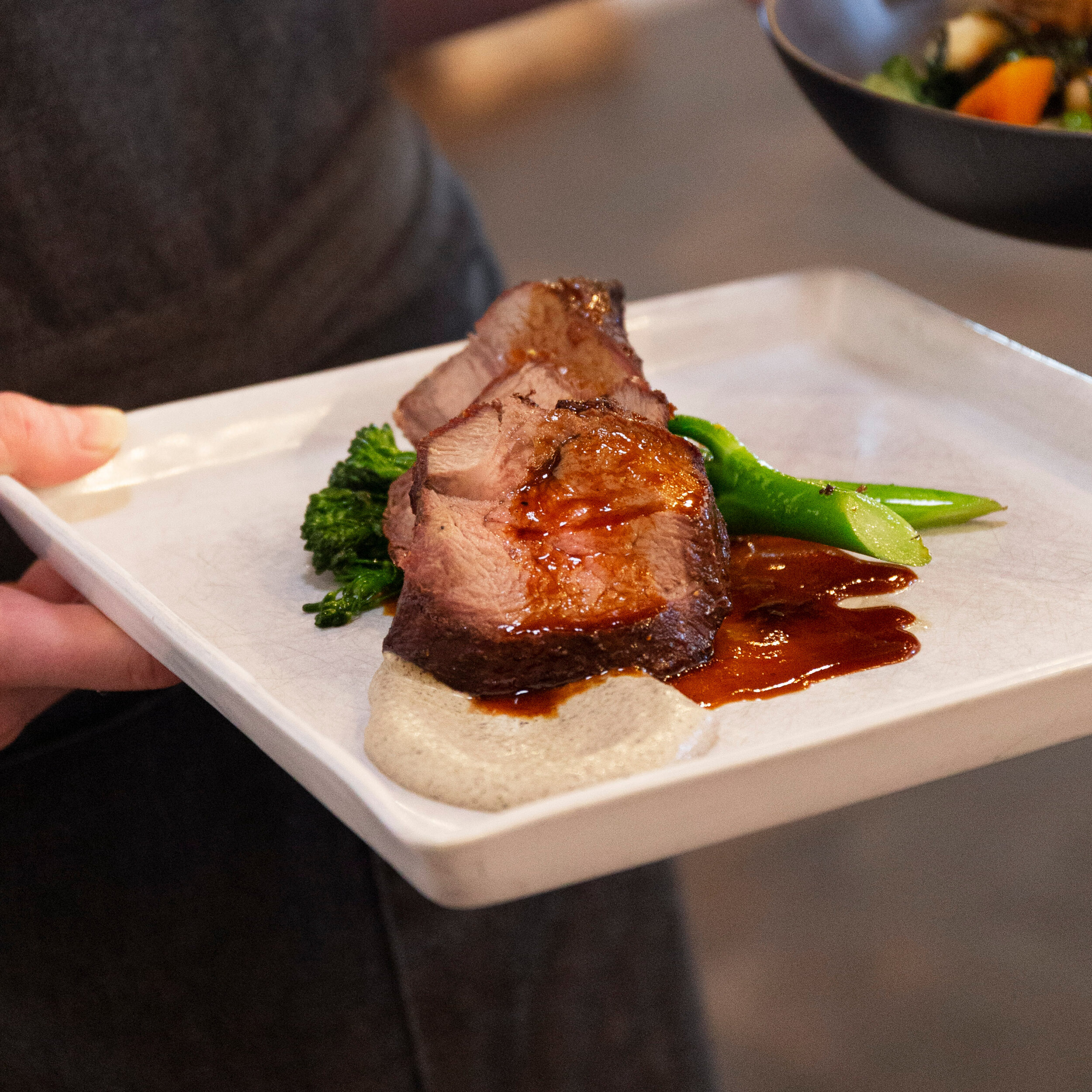 Slow Roasted Beef Striploin, Herbed Potatoes, Bullhorn Peppers, Grilled Zucchini, Jus