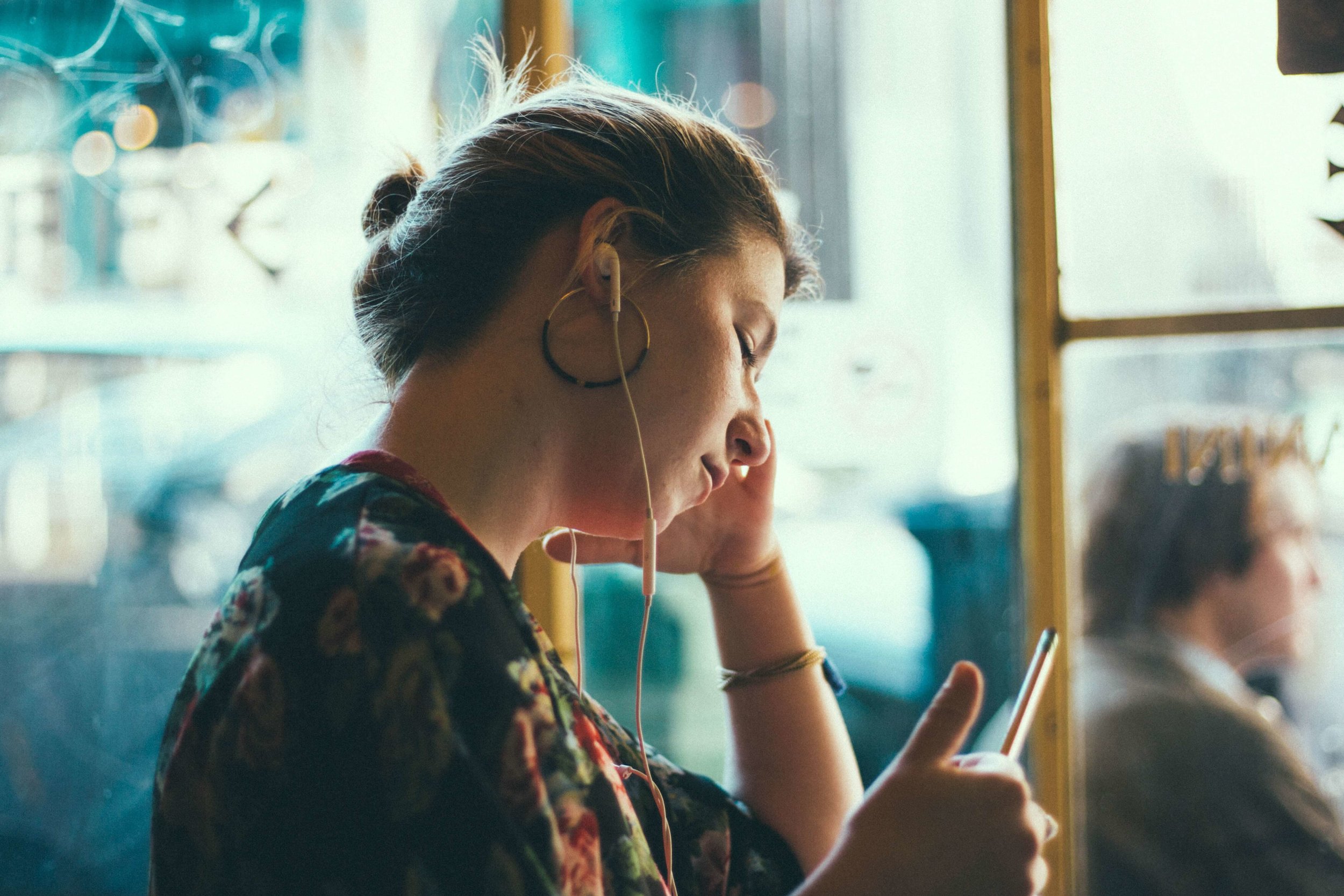 Young woman listening to health podcast