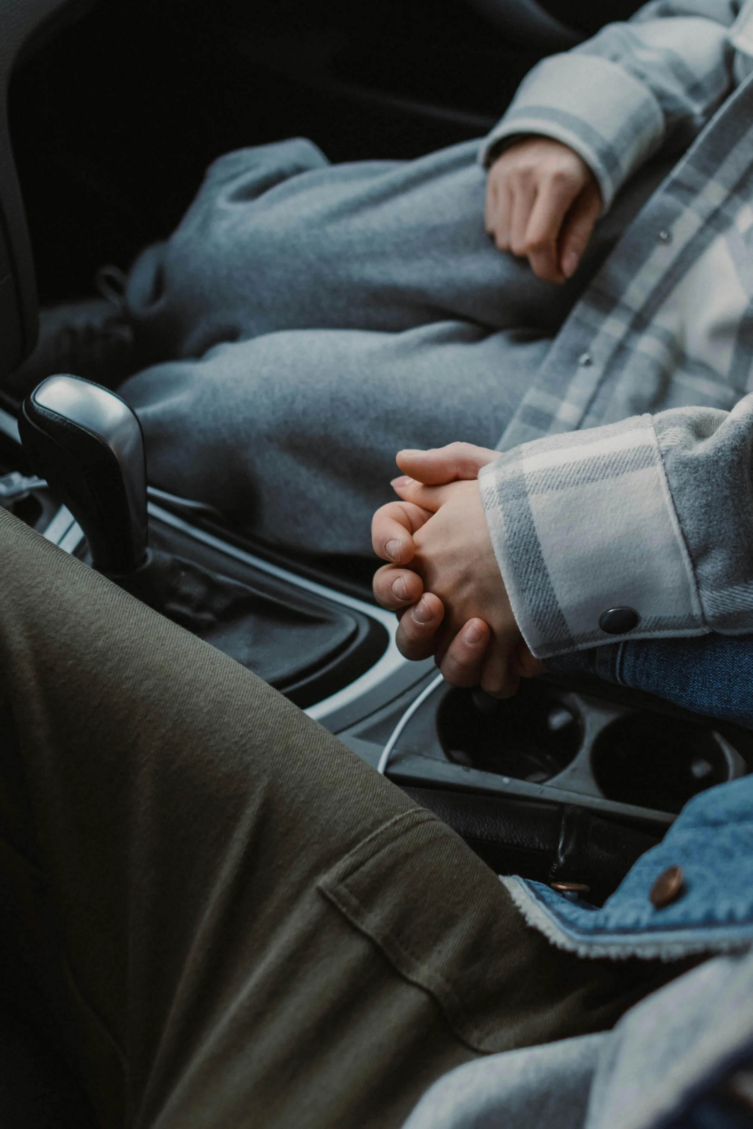A couple holding hands in a car, representing fertility support after pregnancy loss and recurrent miscarriage at South Shore Acupuncture and Wellness, Rockland MA.